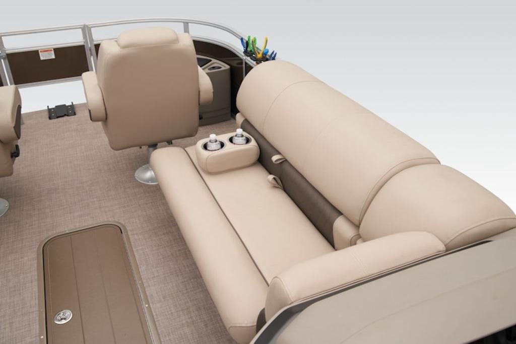 2025 Sun Tracker Sportfish™ 24 XP3 boat interior with beige seating and cup holders.