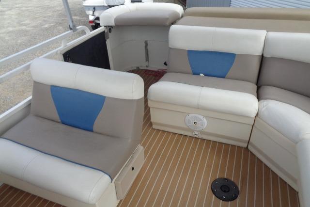 2008 Bentley Pontoons 200 CRUISE interior with beige and blue seating on a wooden deck.