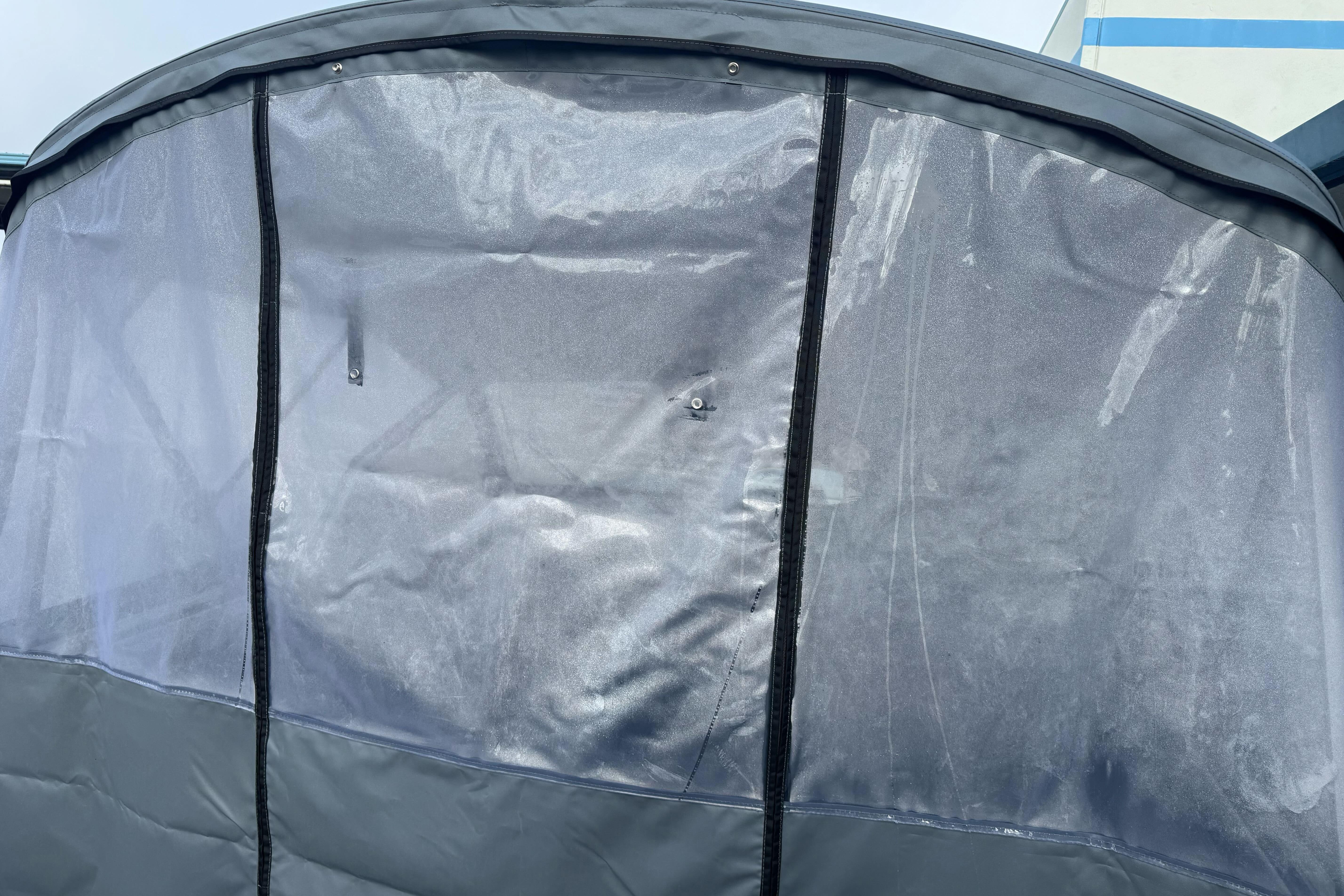 Protective cover on KingFisher 2025 Escape boat, 2026 model, showcasing durable material.
