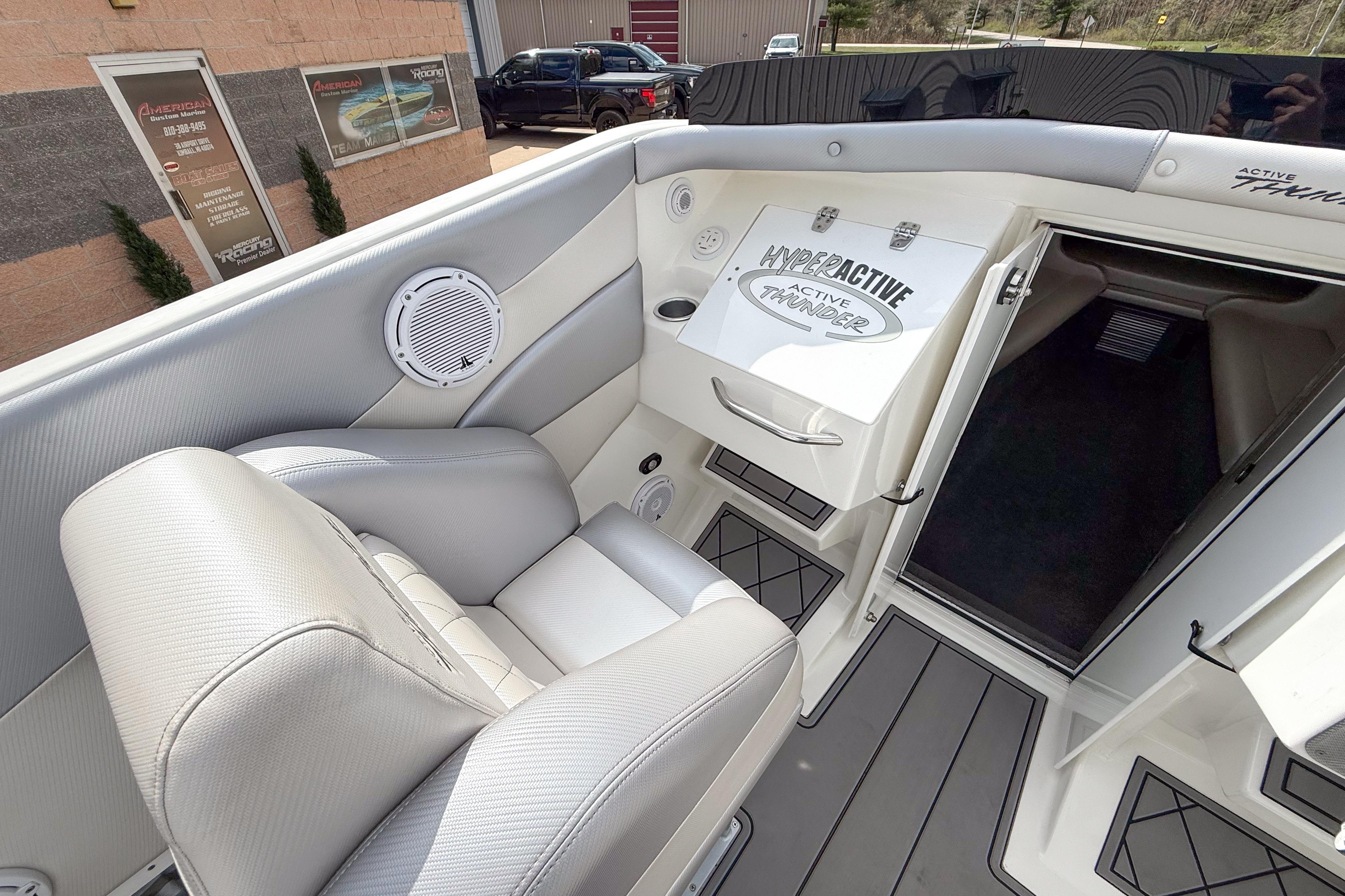 Interior view of a 2002 Active Thunder 37 boat, featuring sleek seating and modern design.