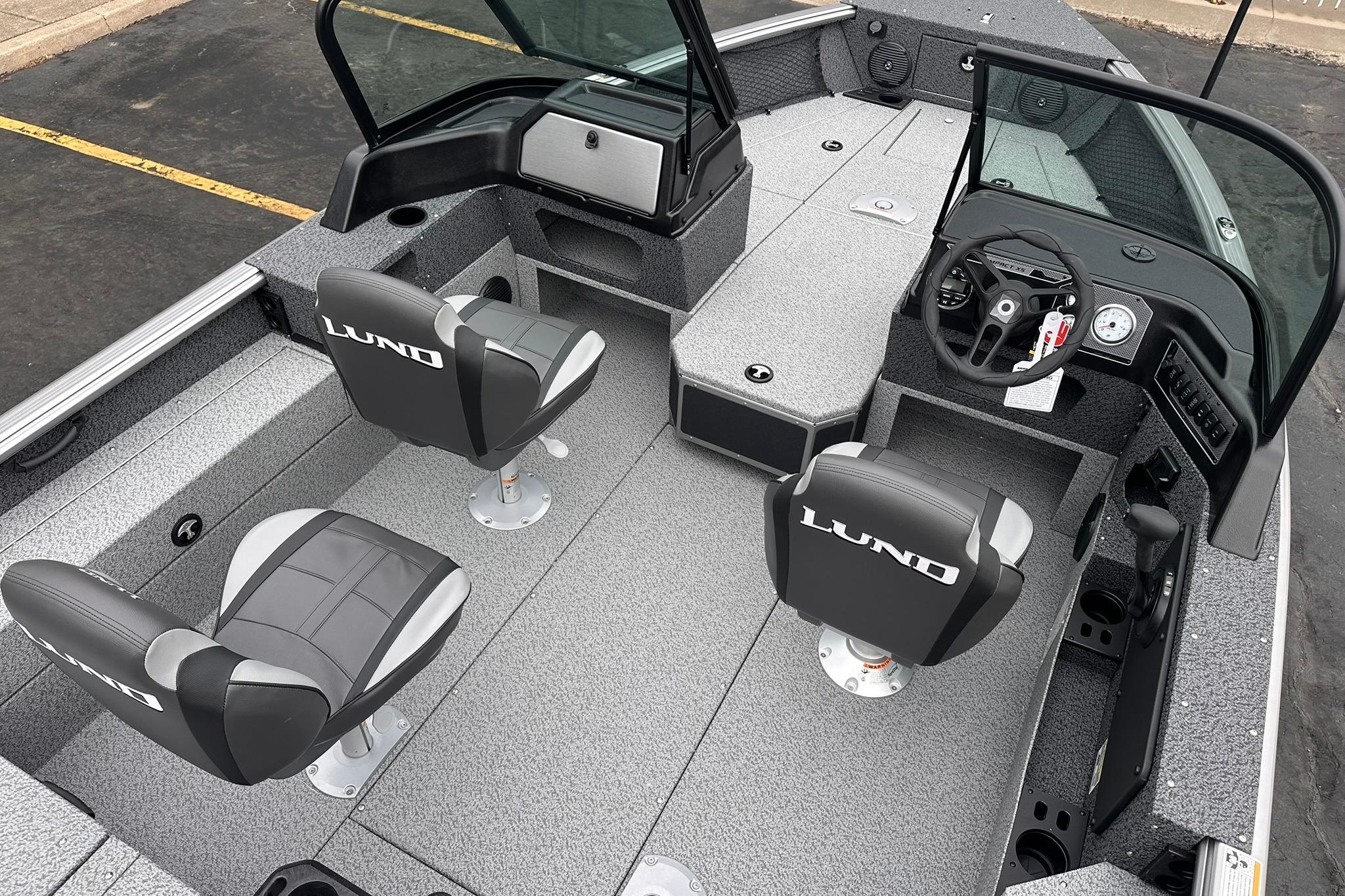 2026 Lund 1775 Impact XS Sport boat interior with seating and steering console.