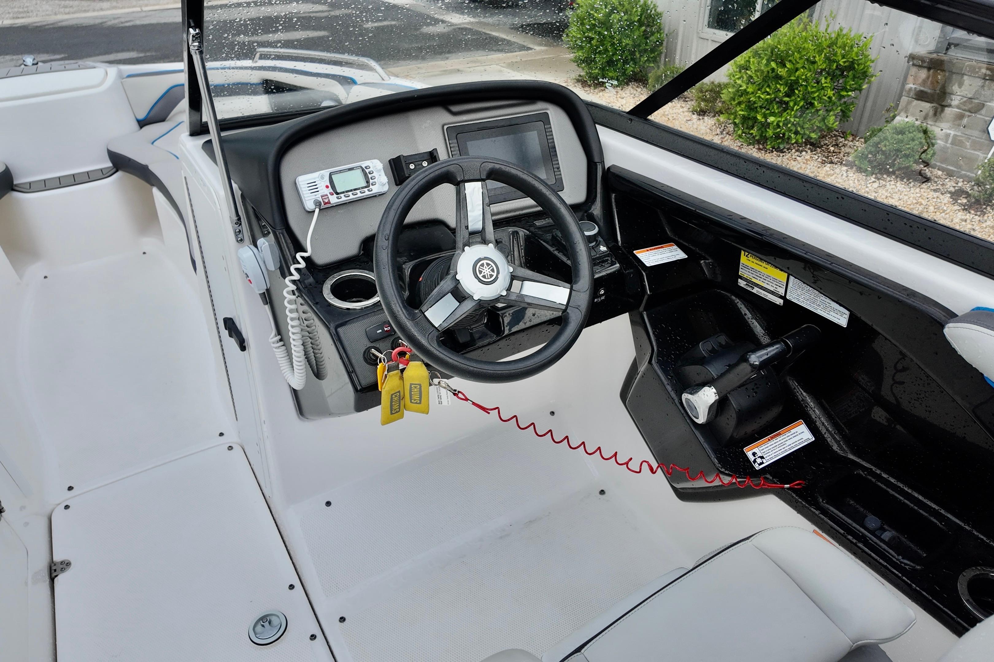 2020 Yamaha Boats AR240 cockpit with steering wheel and control panel.