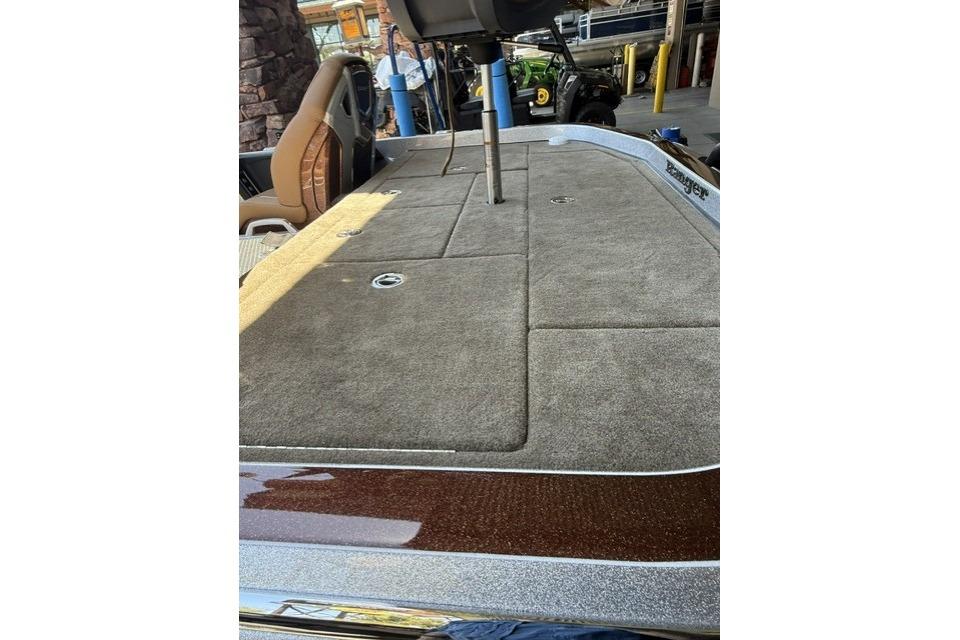 2026 Ranger Z521R Cup-Equipped boat deck with carpeted surface and seating area.