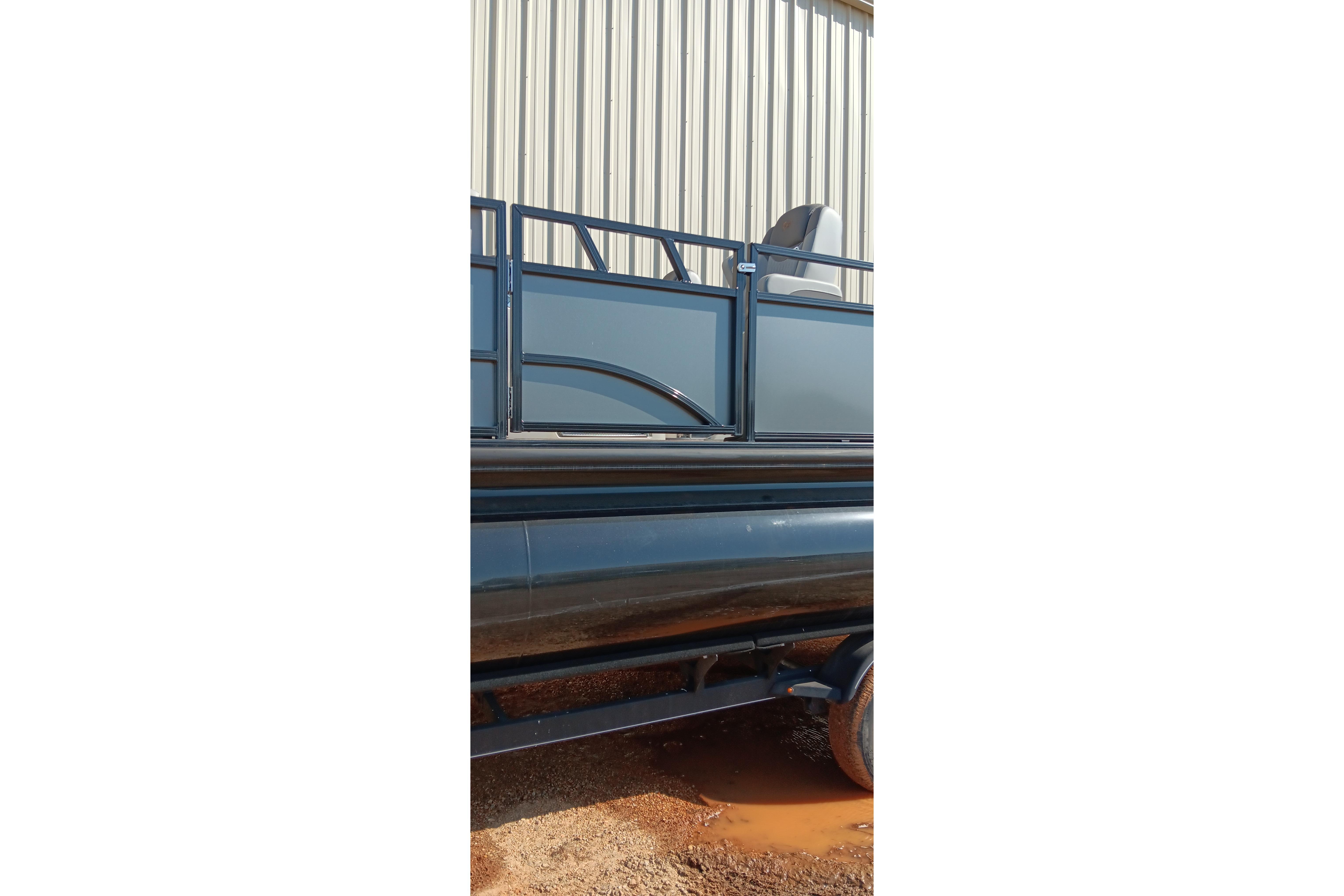 2023 Ranger 2500LS pontoon boat parked near a metal building.
