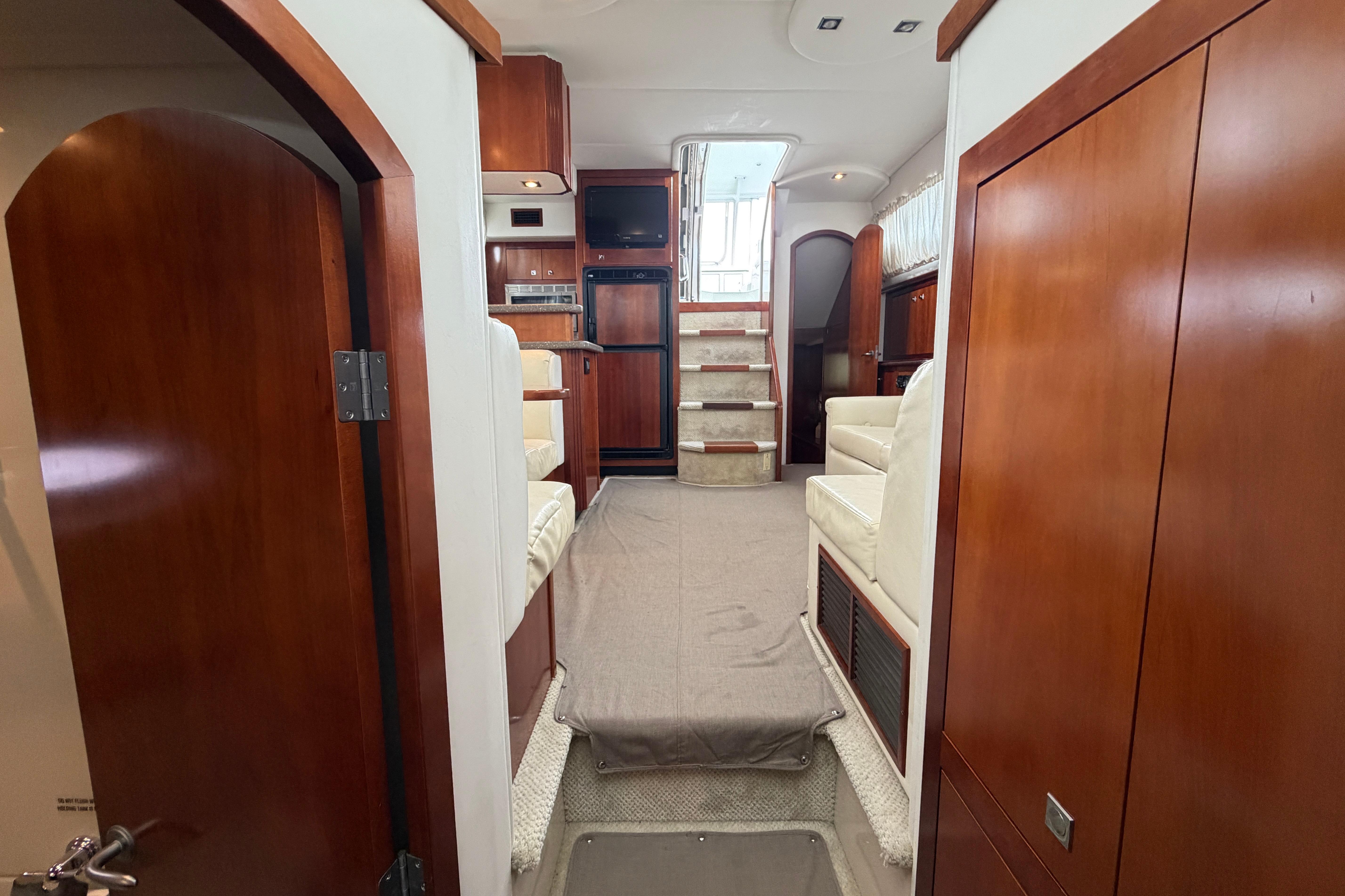 Interior of 2011 Cruisers Yachts 415 Express Motoryacht with wood finishes and seating.