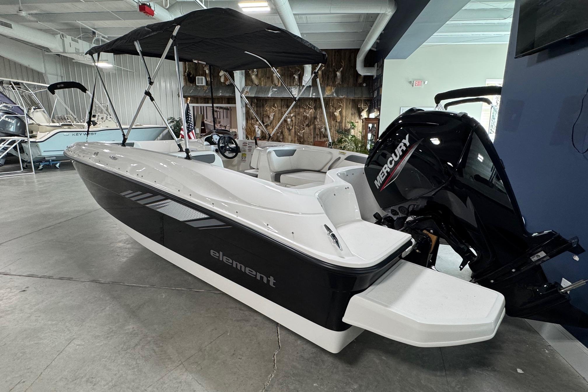 2026 Bayliner Element E18 boat with Mercury engine in showroom.