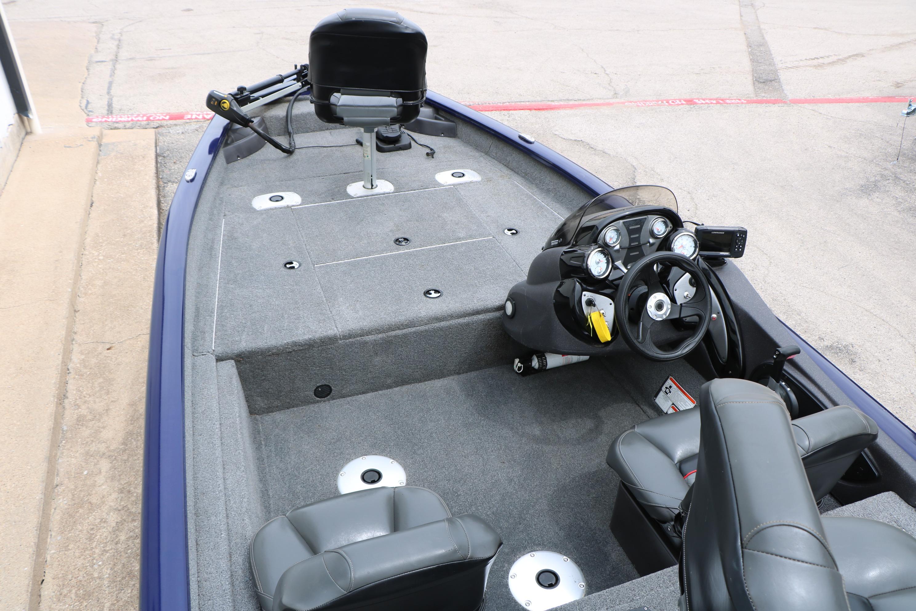 2022 Tracker Pro Team 175 TF boat interior with steering console and seating.