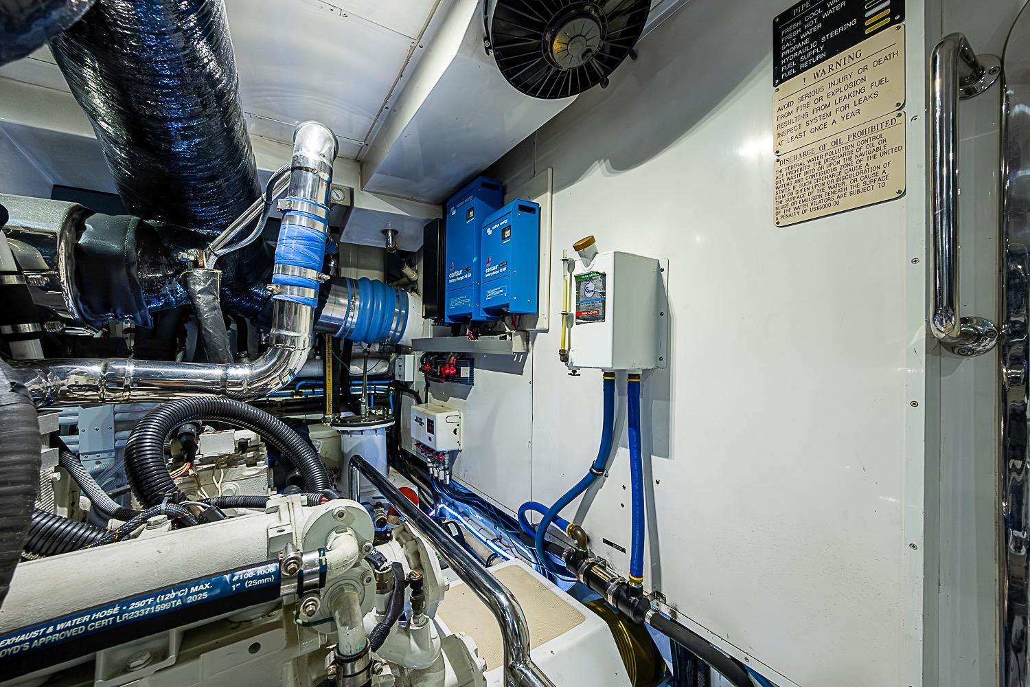 Engine room of 2014 Marlow 80 Explorer yacht, featuring mechanical and electrical components.