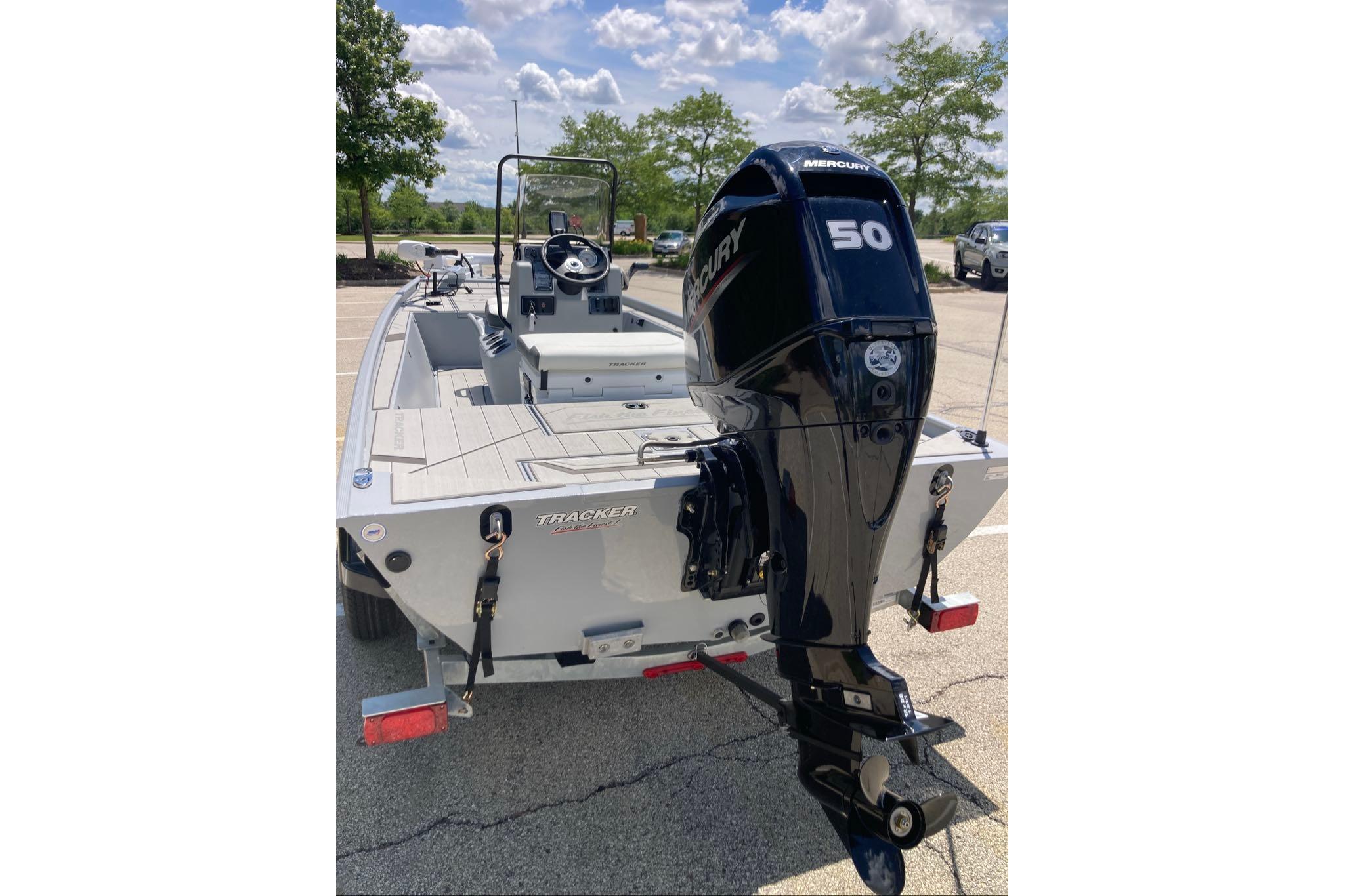 2026 Tracker Bass Tracker Classic CC boat with Mercury 50 engine in parking lot.