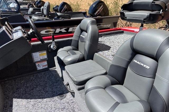2026 Tracker Pro Team 175 boat interior with gray seating and steering console.