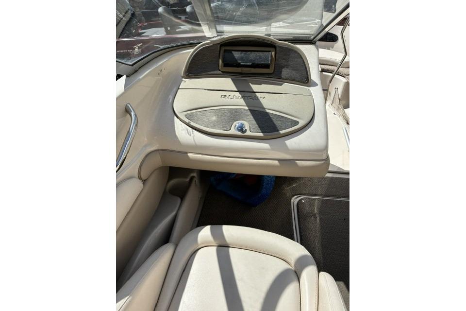 2003 Glastron GX 185 Ski & Fish boat interior with dashboard and seating.