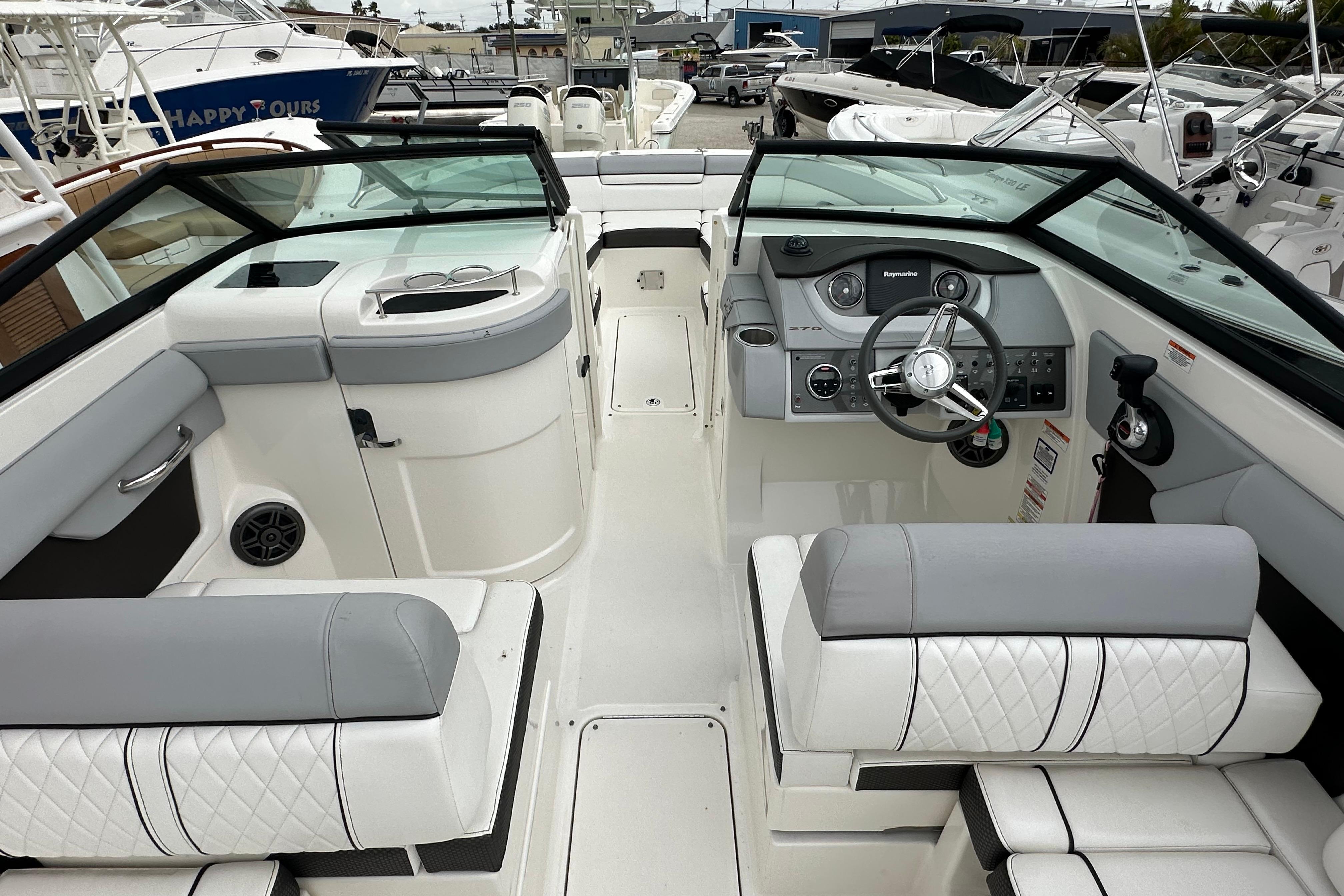 2016 Sea Ray 270 Sundeck interior with modern helm and seating.