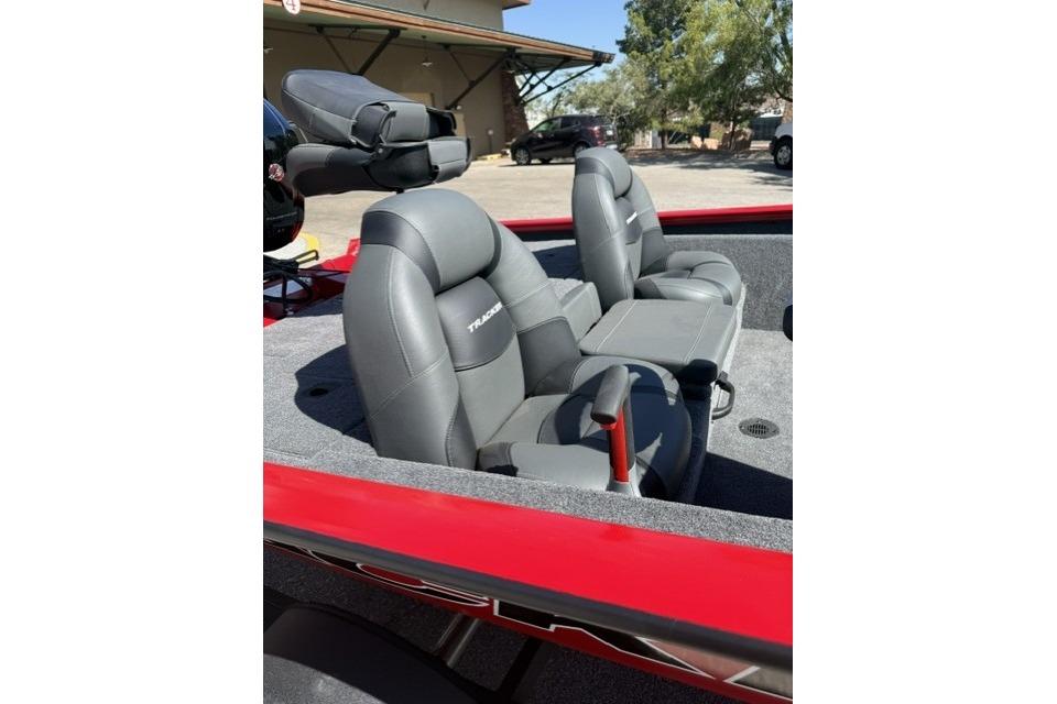 2026 Tracker Pro Team 190 boat interior with gray seats and red trim.