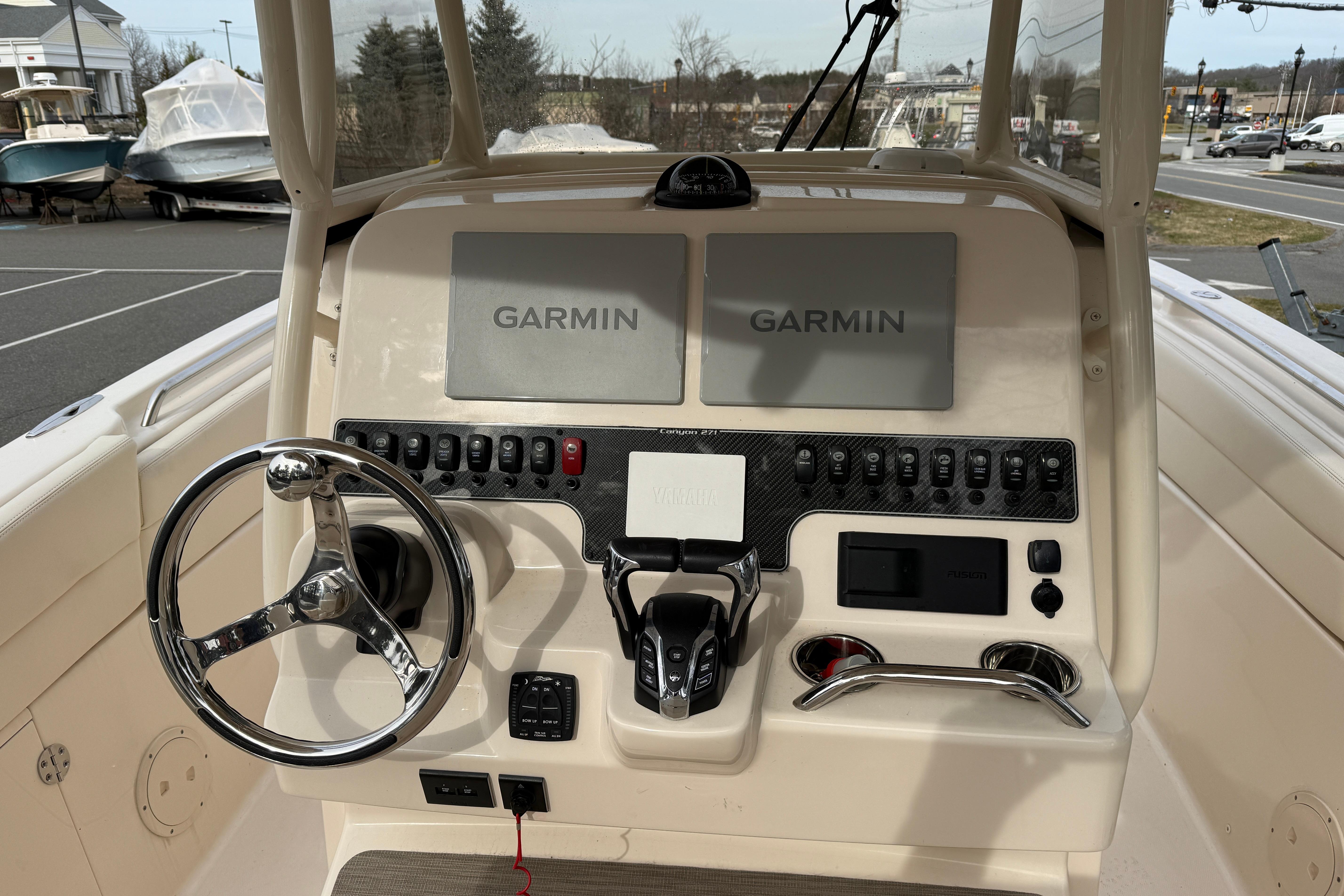 2024 Grady-White Canyon 271 boat dashboard with Garmin navigation displays.