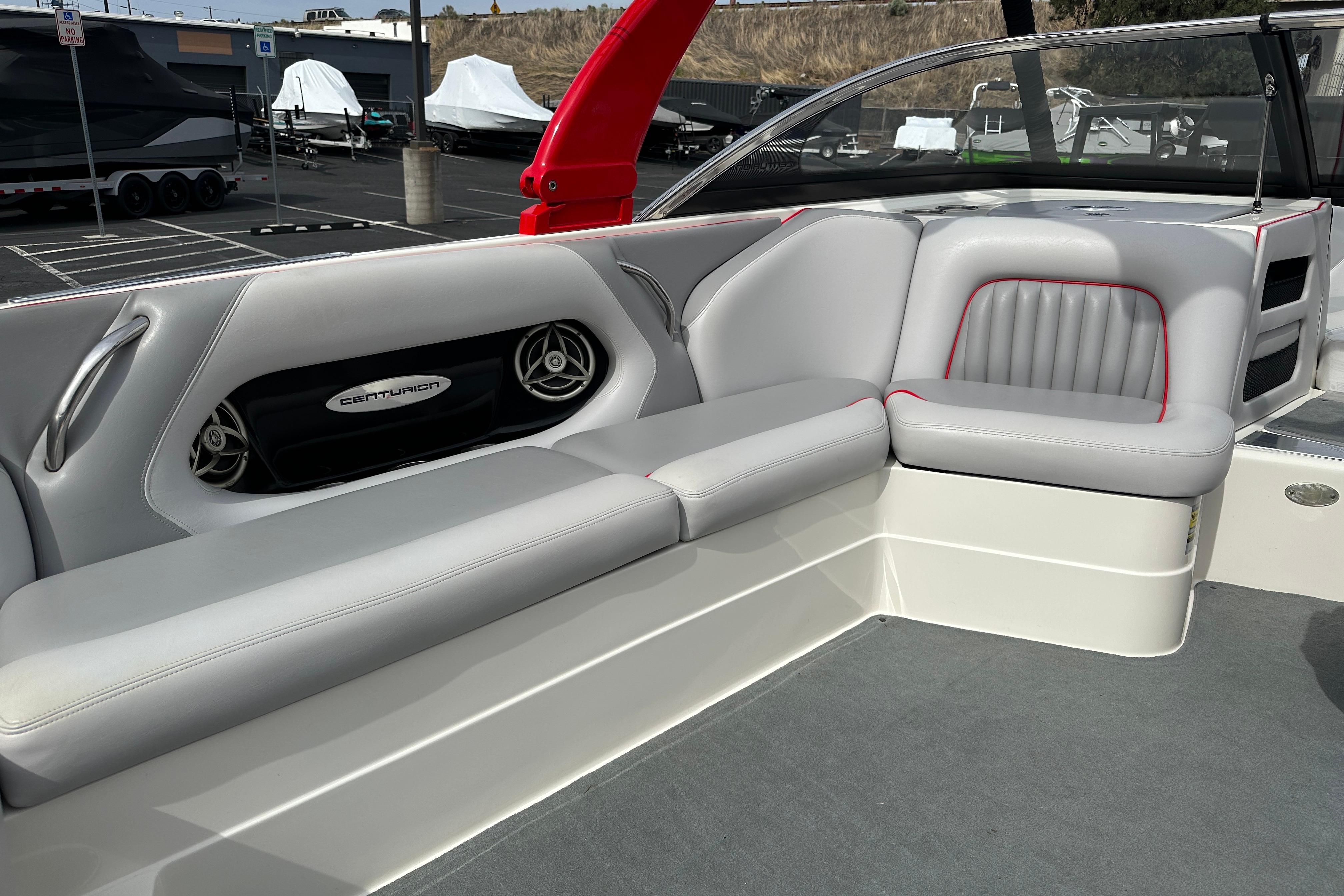 2008 Centurion Enzo SV240 boat interior with gray seating and branded speaker system.
