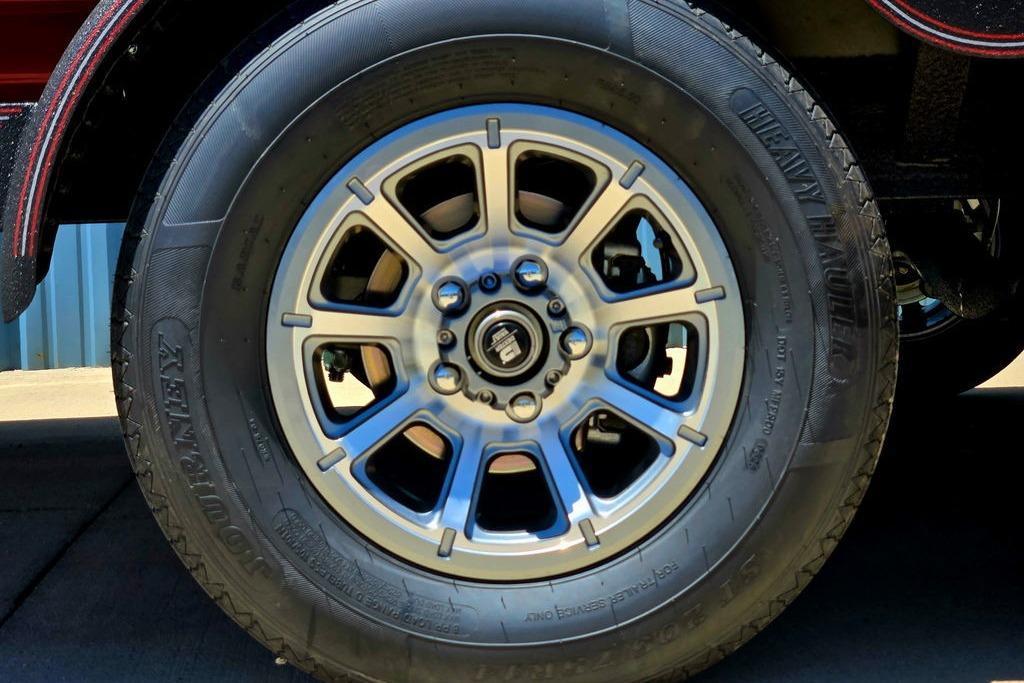 2026 Skeeter ZXE20 wheel with heavy-duty tire on a sunny day.