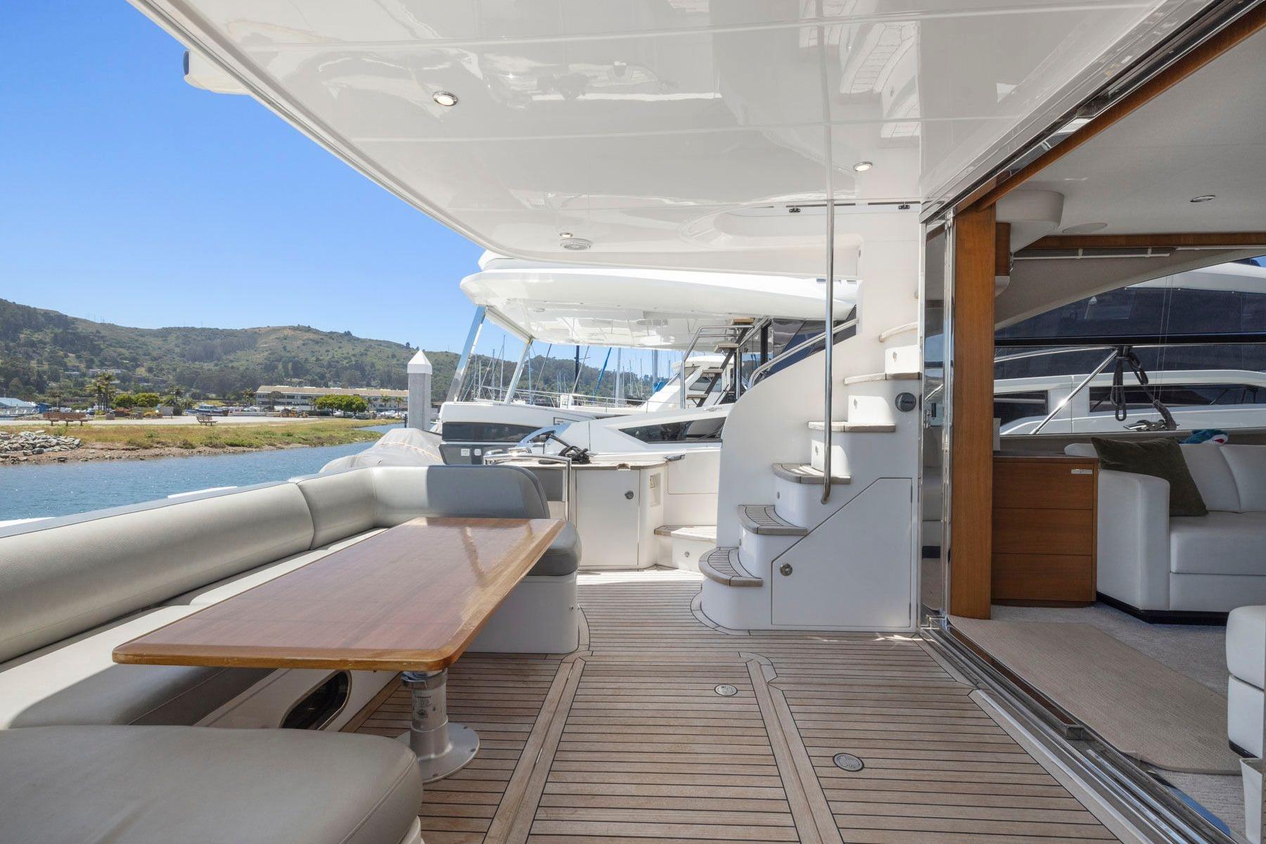 Luxurious 2015 Princess 60 Flybridge Motor Yacht with spacious deck and elegant interior.