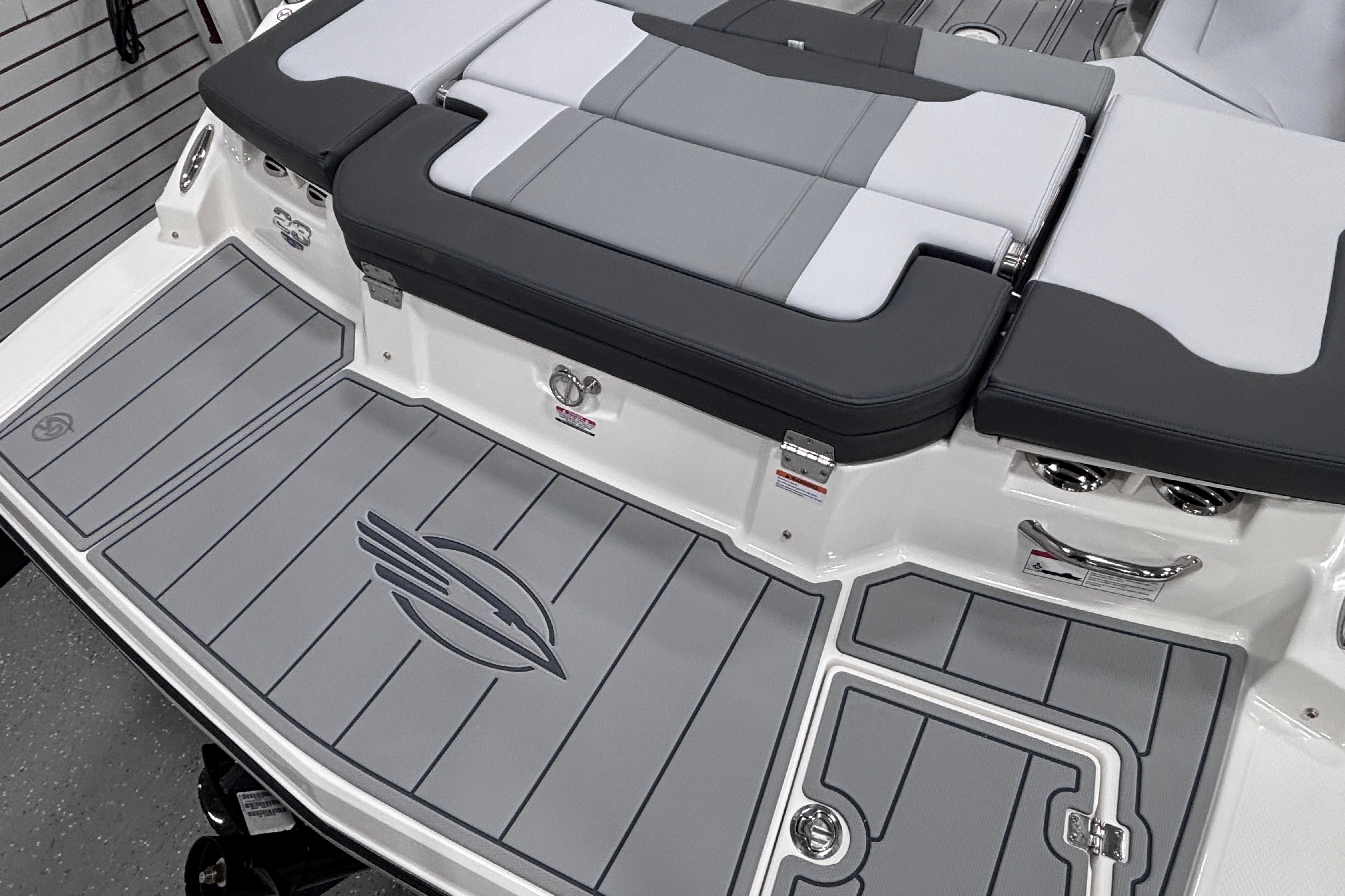 2026 Chaparral 23 SSi boat with sleek gray deck and cushioned seating.