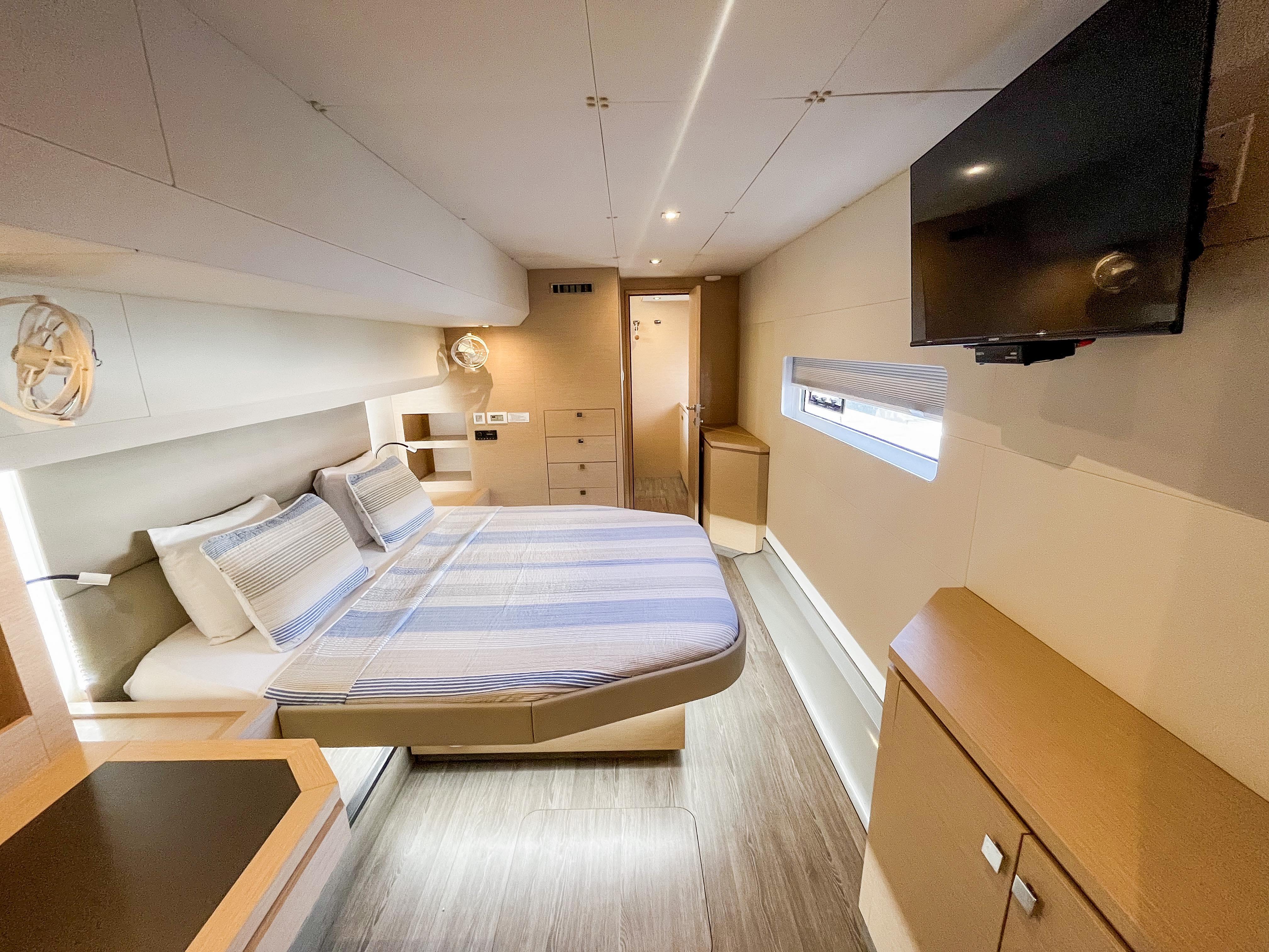 Luxurious cabin interior of 2020 Fountaine Pajot MY 44 yacht with modern amenities.