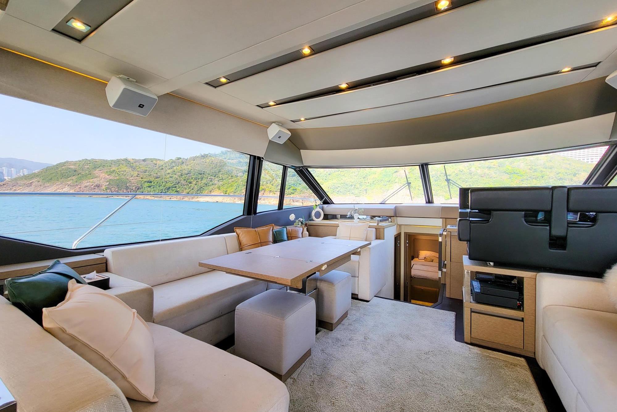 Luxurious interior of a 2019 Prestige 630 yacht with scenic ocean view.