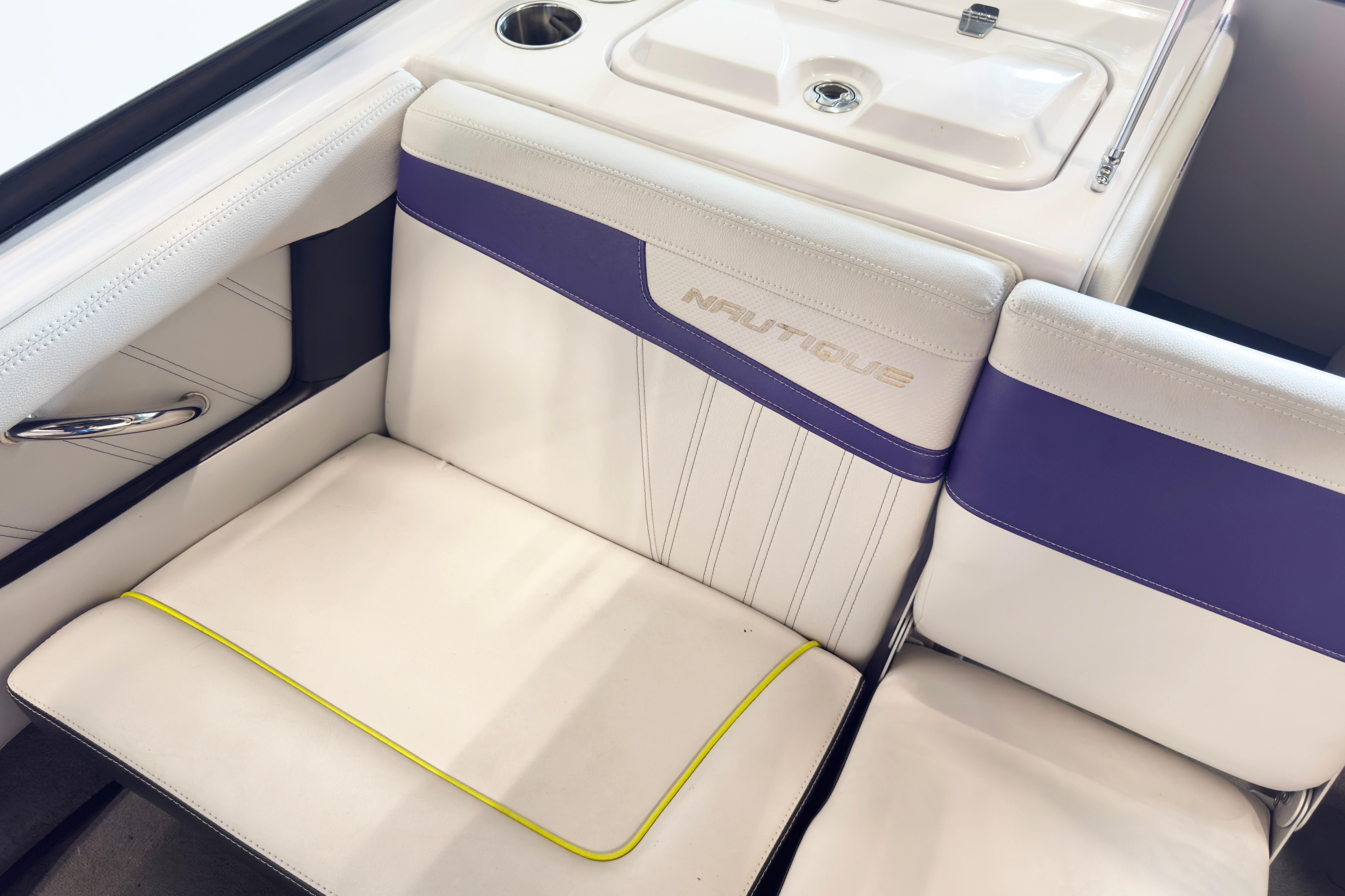 2014 Nautique Ski Nautique 200 Closed Bow interior with white and purple seating.