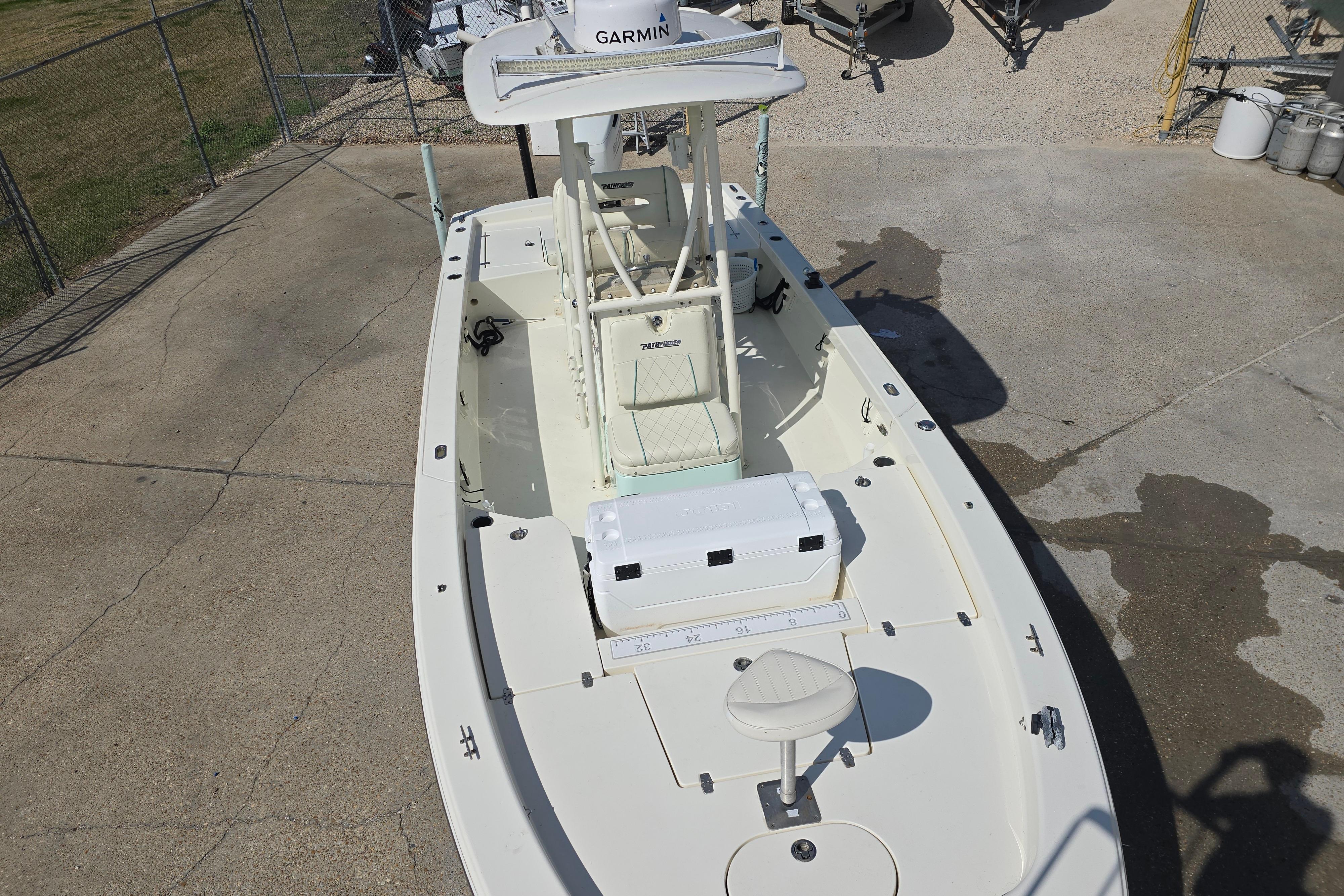 2016 Pathfinder 2600 HPS boat with Garmin equipment, docked on concrete surface.
