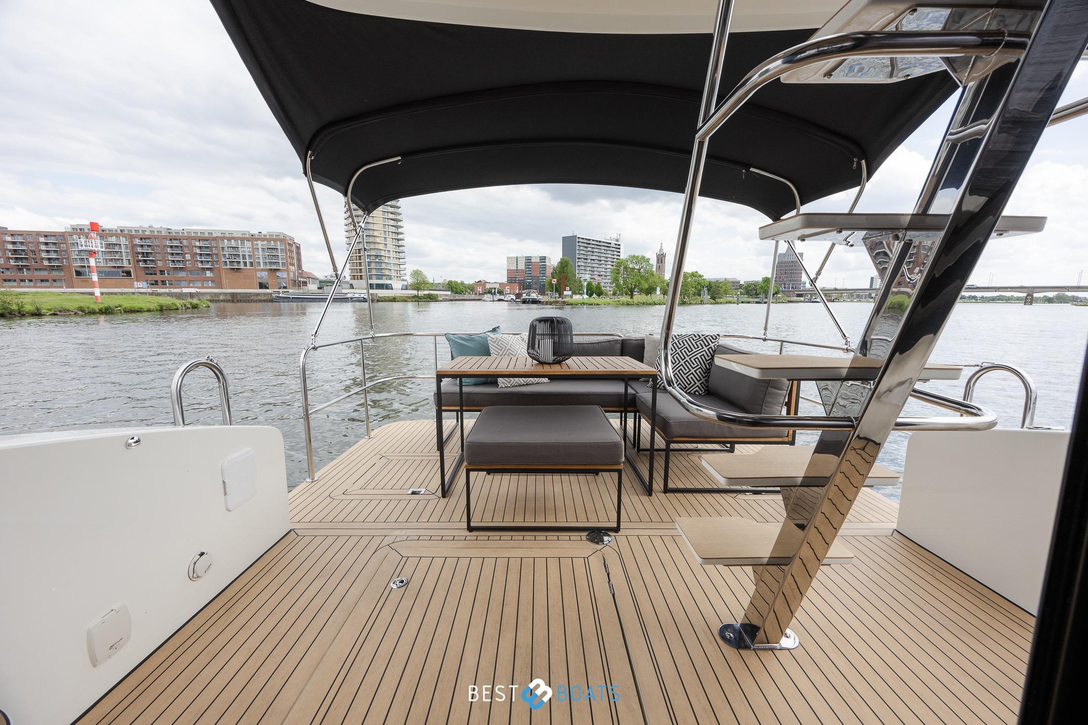 2023 Cobra Yachts Futura 36 Premium Fly deck with seating and river view.