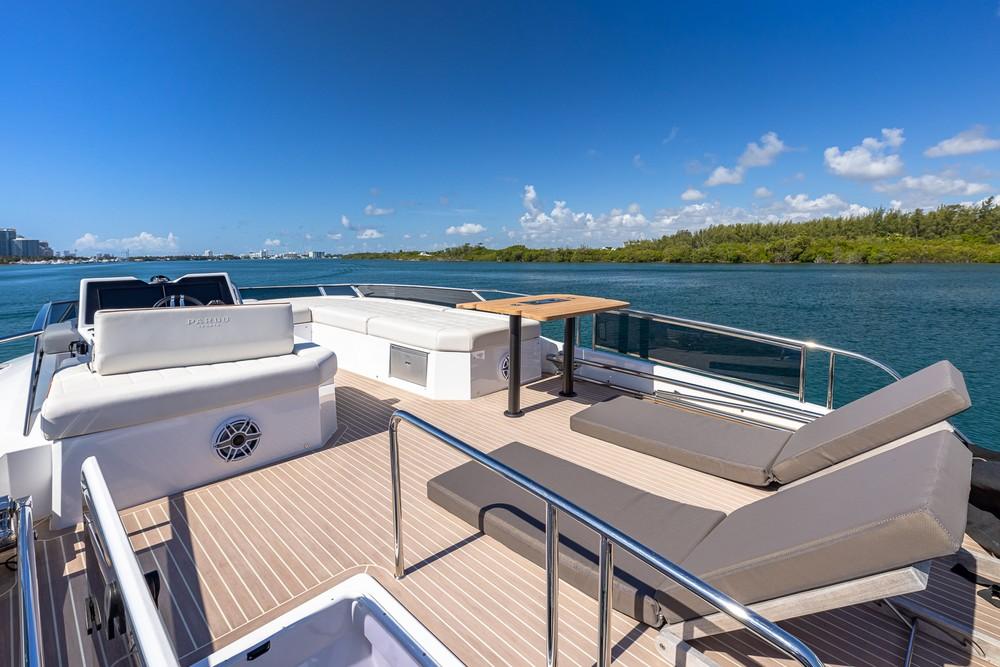 2024 Pardo Yachts E60 deck with sun loungers and scenic water view.
