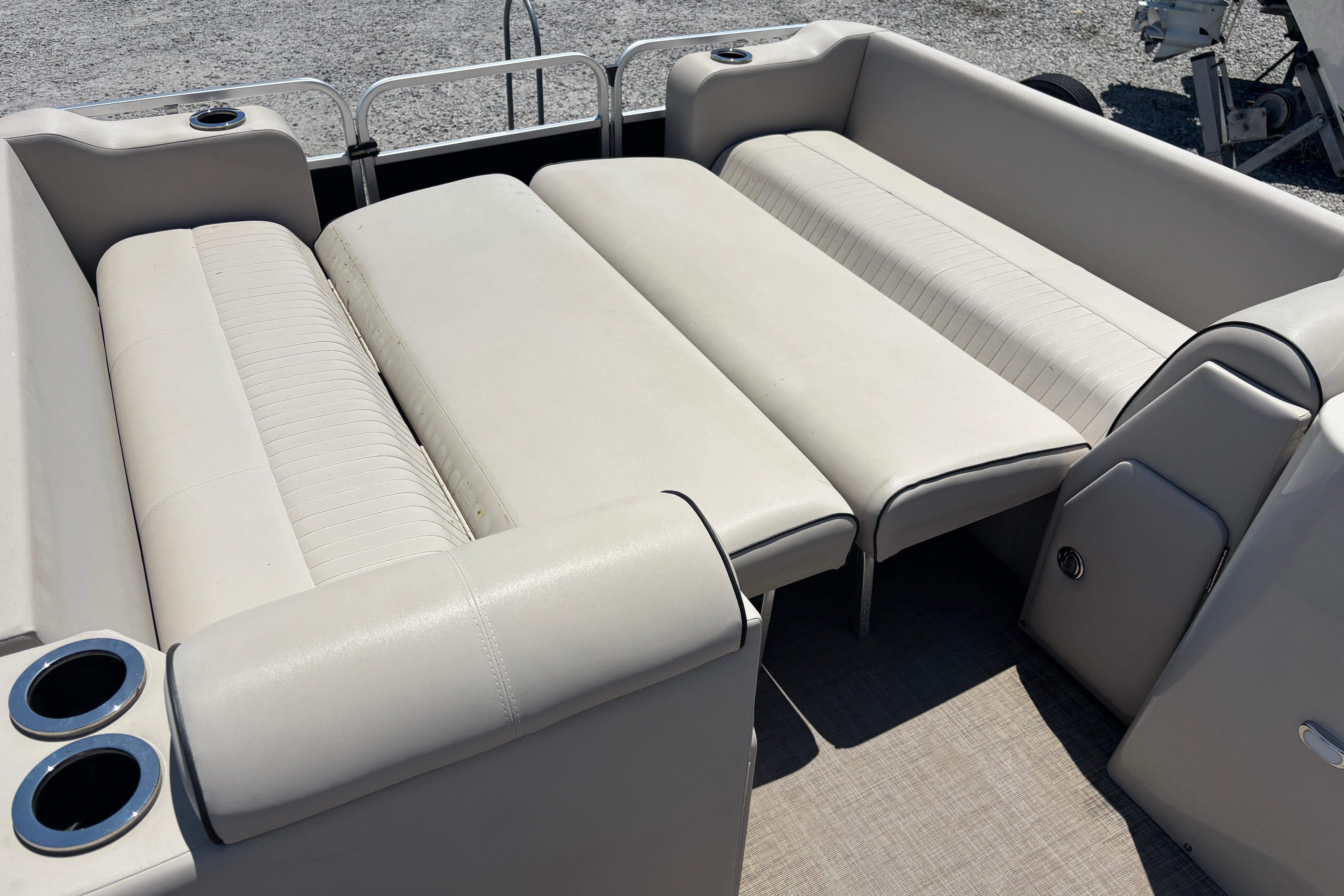 2017 Qwest LS 822 Bar boat interior with beige seating and cup holders.