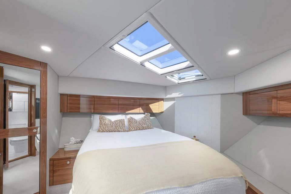 Manufacturer Provided Image: Luxurious Maritimo M50 2026 yacht bedroom with skylight and elegant wood accents.