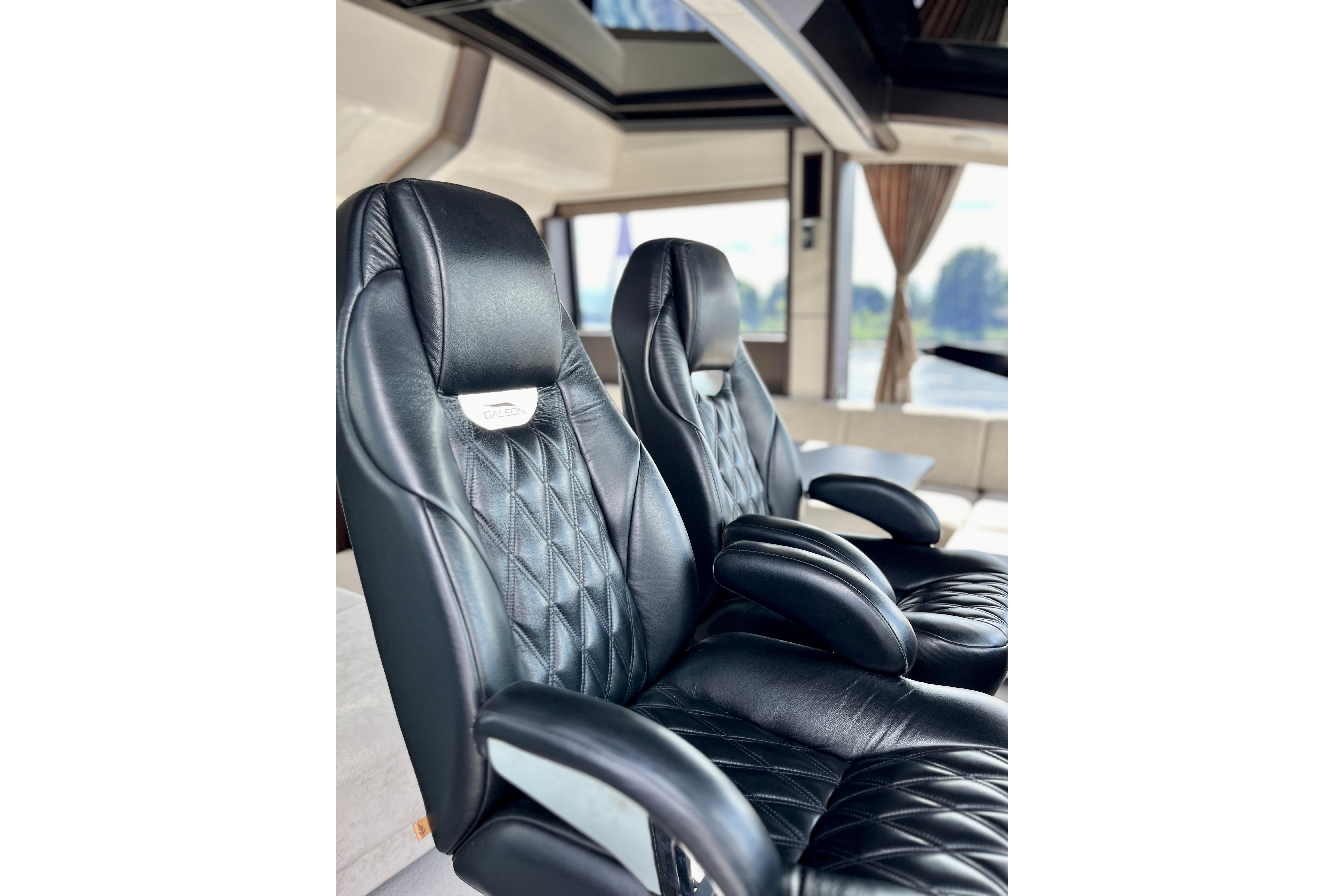 Luxurious black leather seats inside 2025 Galeon 700 Sky yacht.