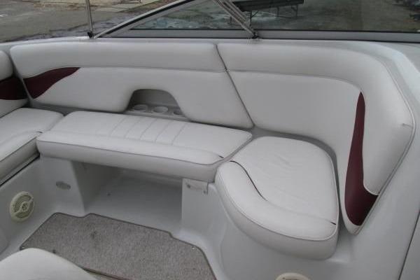 2004 Crownline 288 BR boat interior with white and maroon seating.
