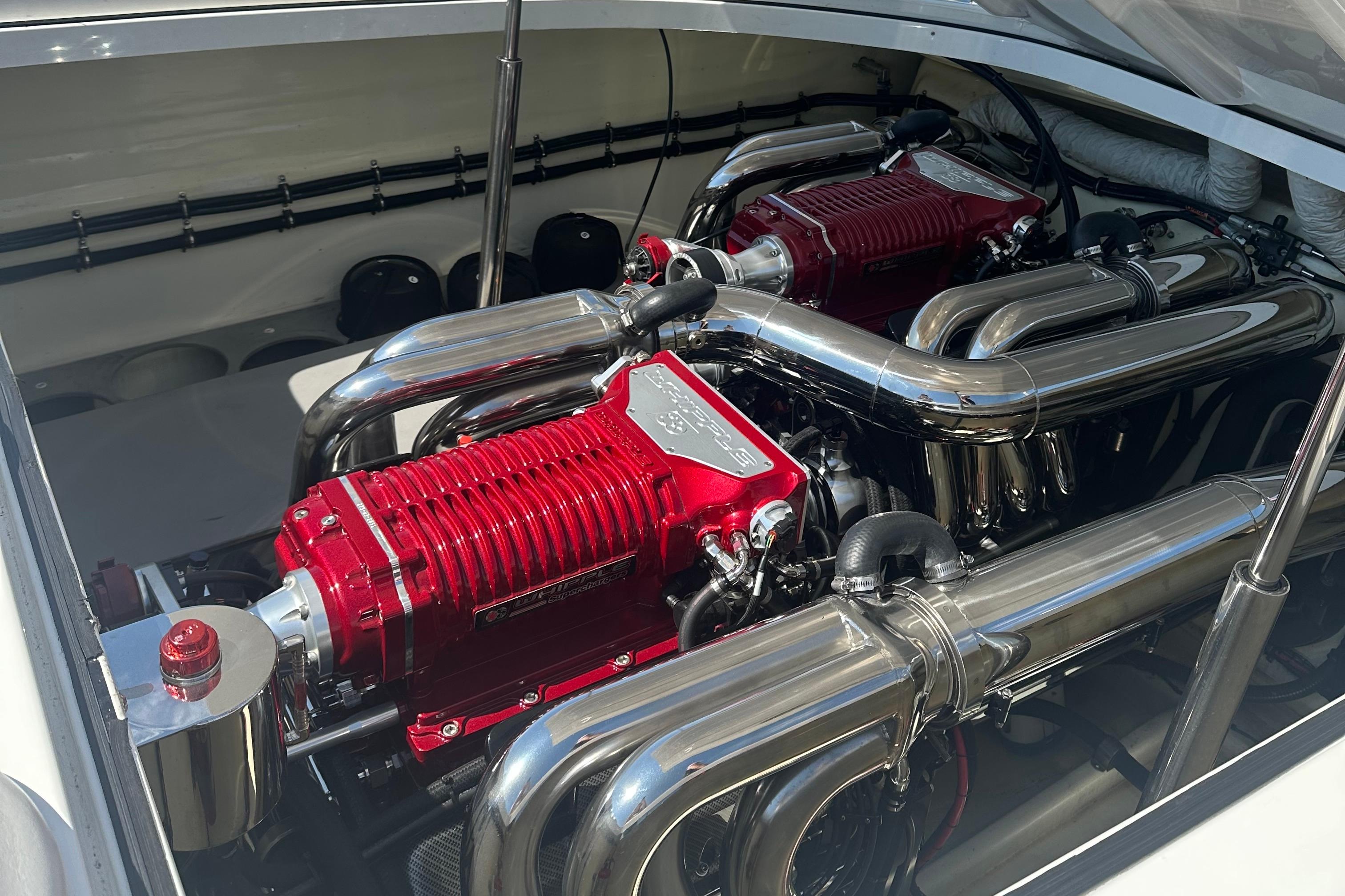 Engine compartment of a 2013 Nordic 39 POKER RUN boat with dual red engines.