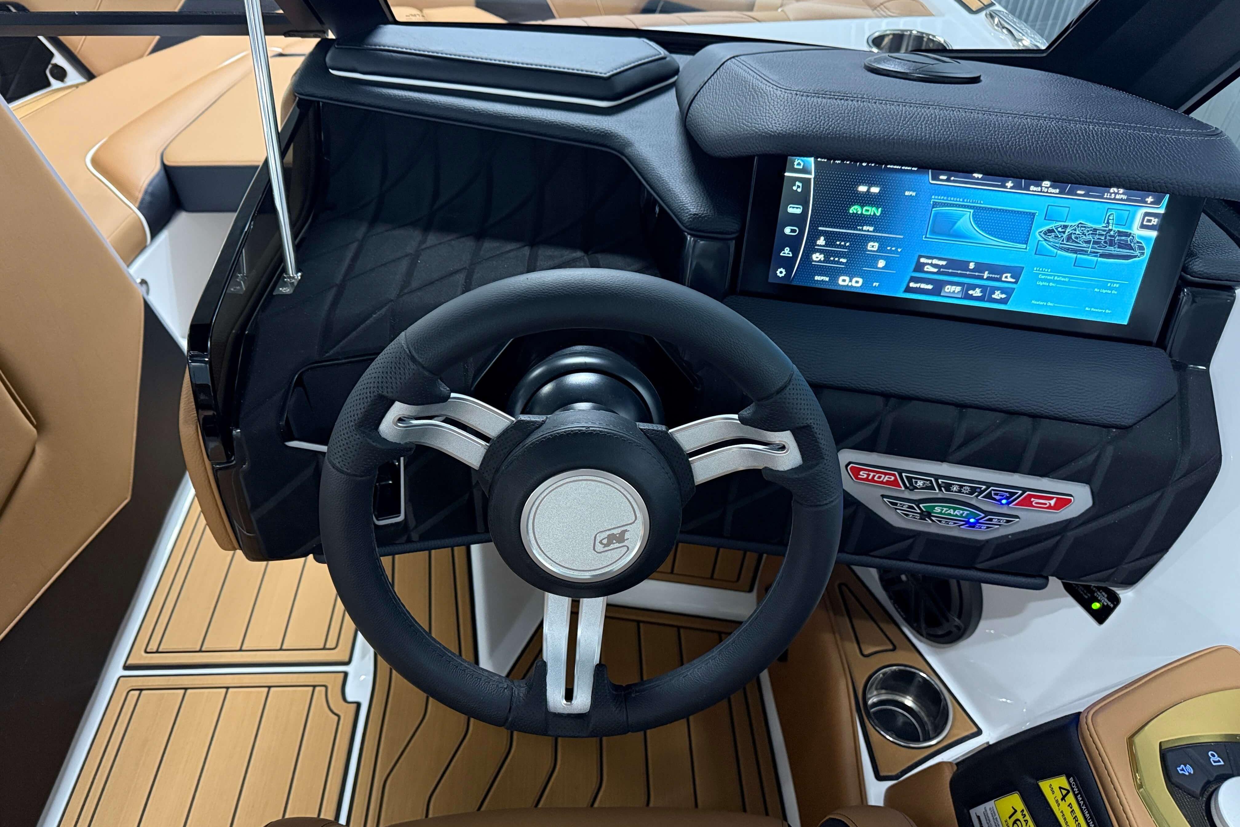 2026 Nautique Super Air Nautique S23 dashboard with touchscreen and steering wheel.