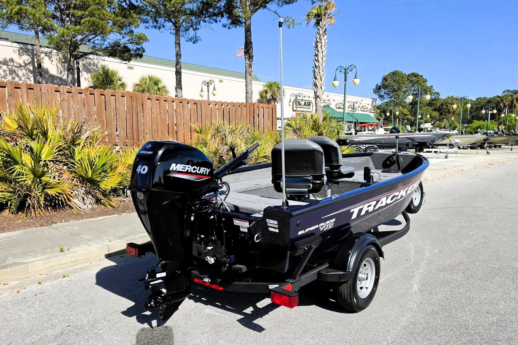 2026 Tracker Super Guide V-16 T boat with Mercury engine in a sunny outdoor setting.