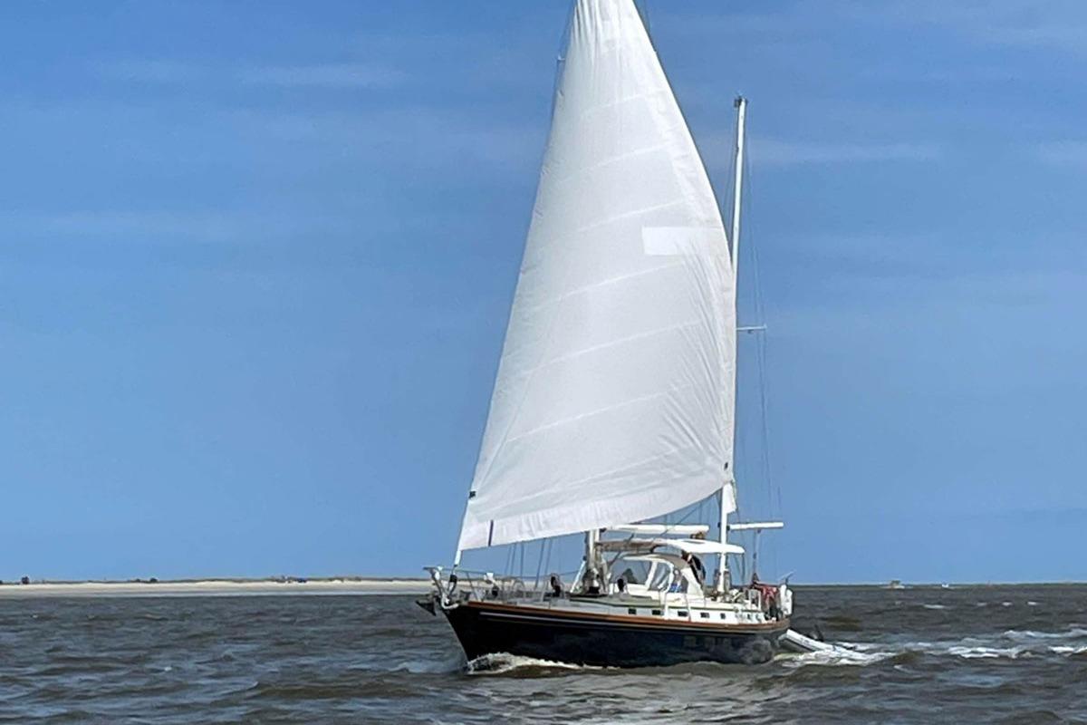 Sailing yacht Little Harbor 53 from 1988 navigating open waters under clear skies.