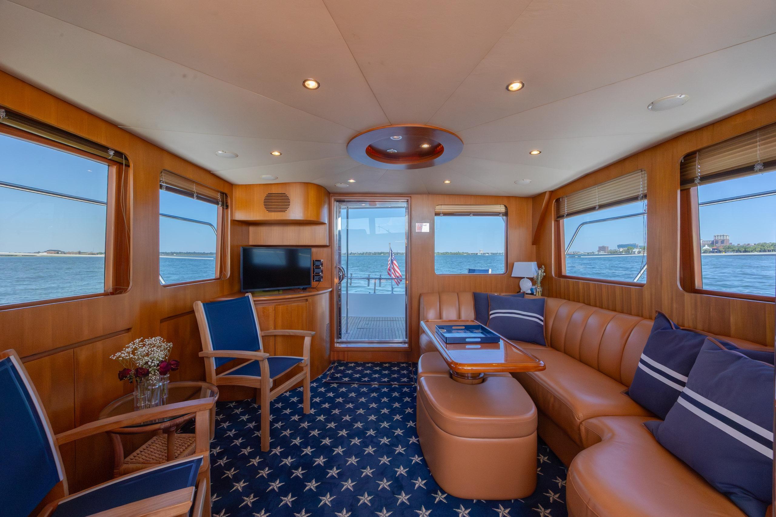 Luxurious interior of 2005 Ocean Alexander 52 Sedan yacht with leather seating and ocean views.