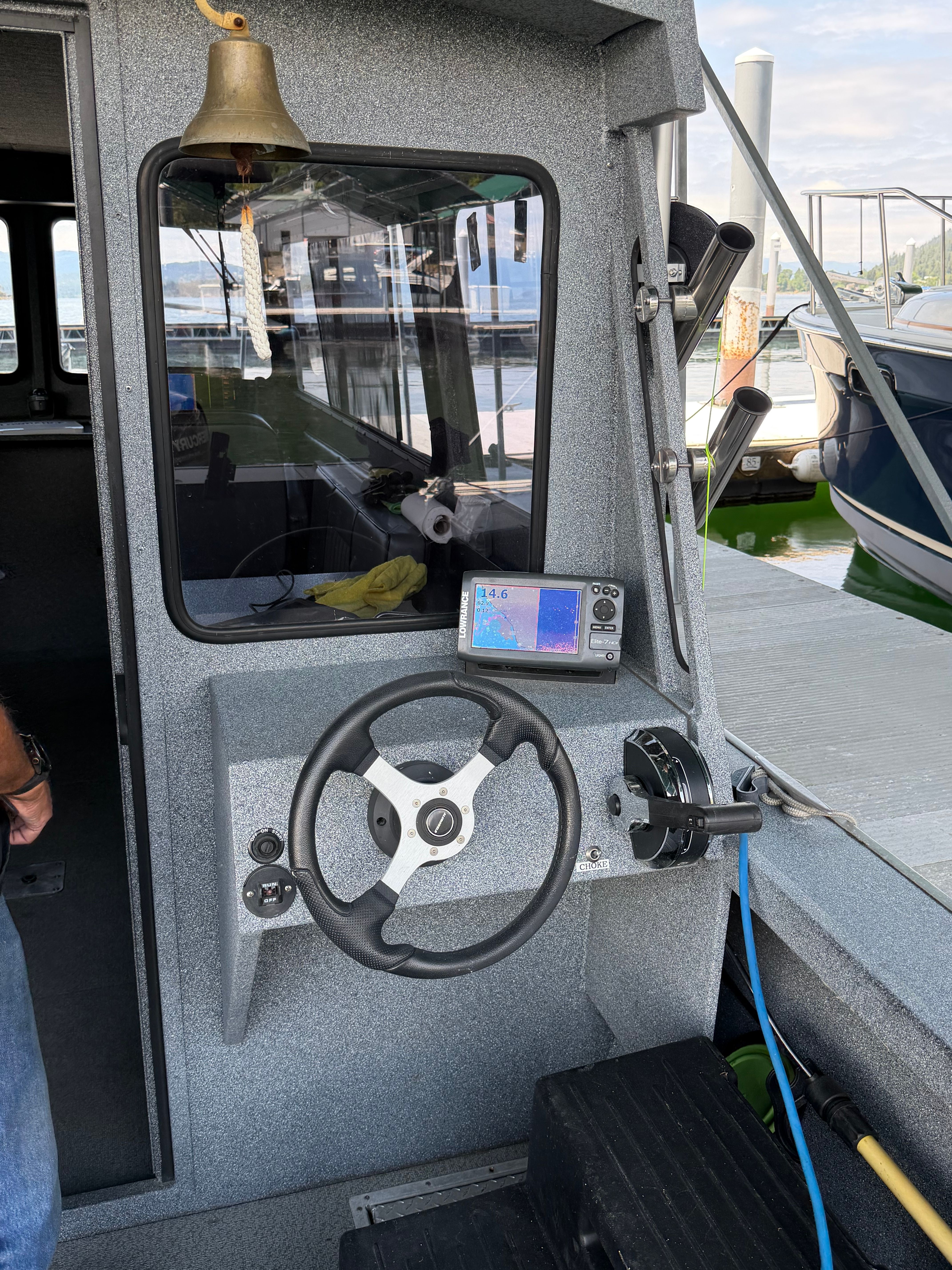 Helm of a 2013 Alumaweld Pacific 27 boat with navigation system.