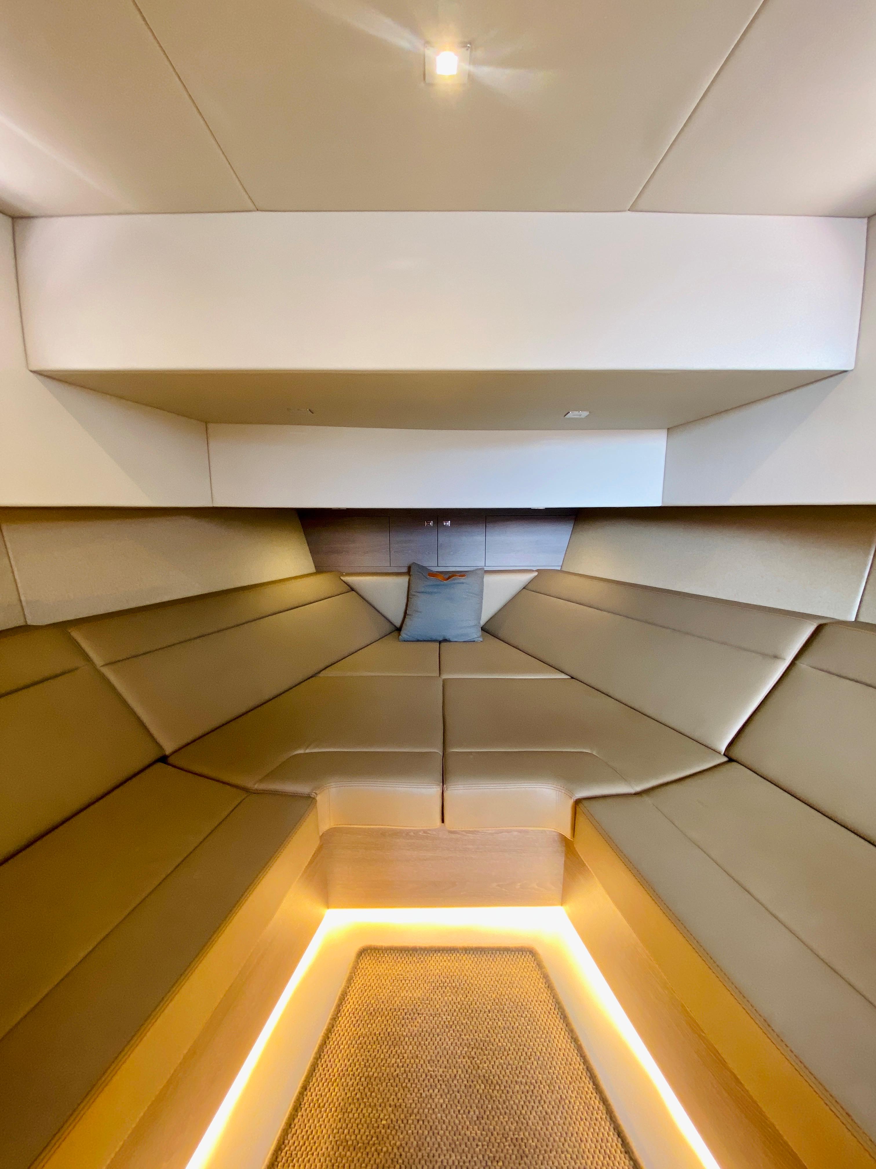 Luxurious interior of 2020 Vanquish VQ45 yacht with modern lighting and seating.