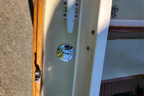 1985 Wasque Down East Cruiser deck with cleat and chrome fitting.