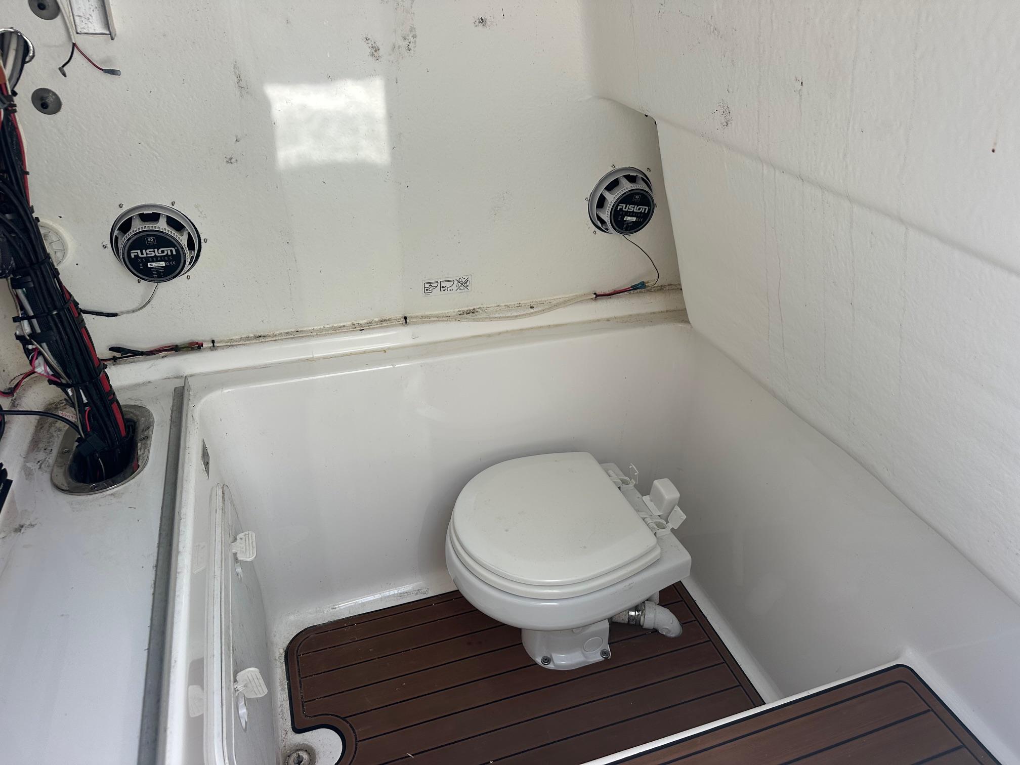 2023 Cape Horn 32xs boat interior with toilet and Fusion speakers.