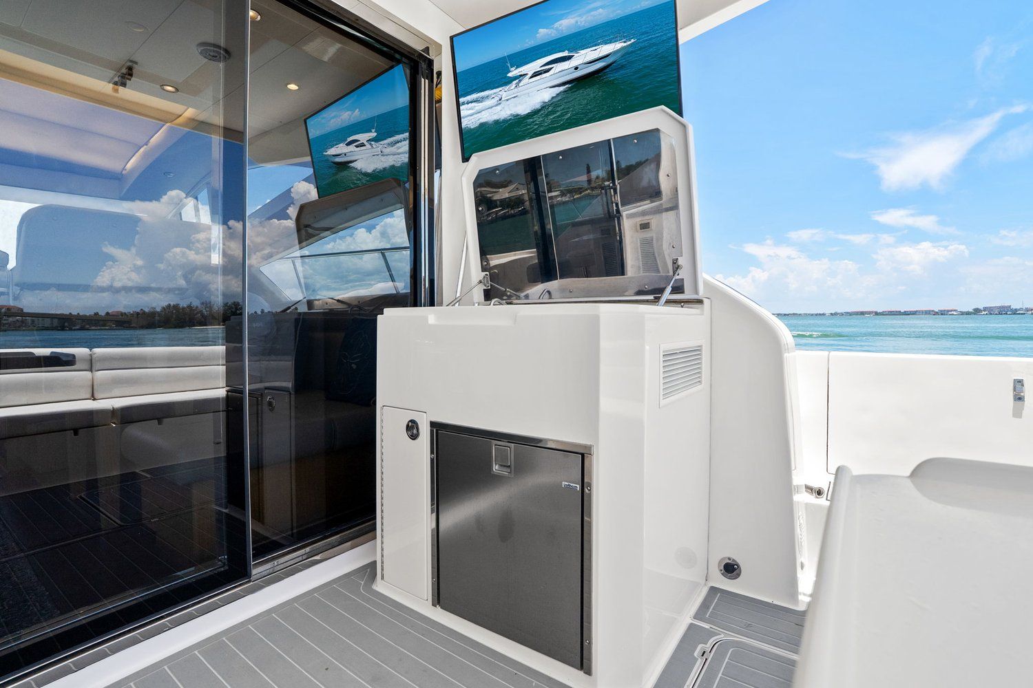 A modern catamaran with sleek features and a view of the sea.