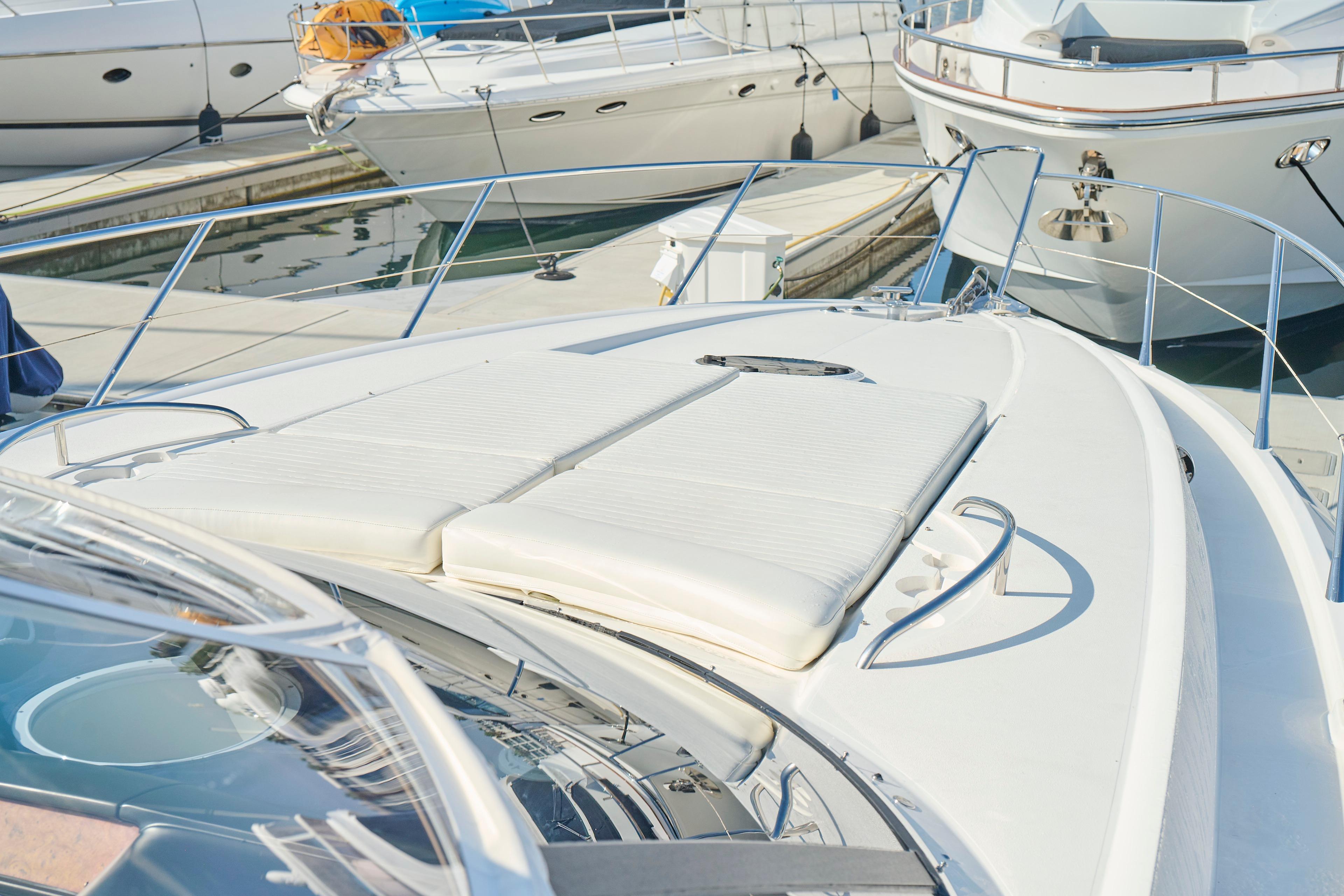 Sunseeker Camargue 50 yacht, 2000 model, docked with sunbathing area visible.
