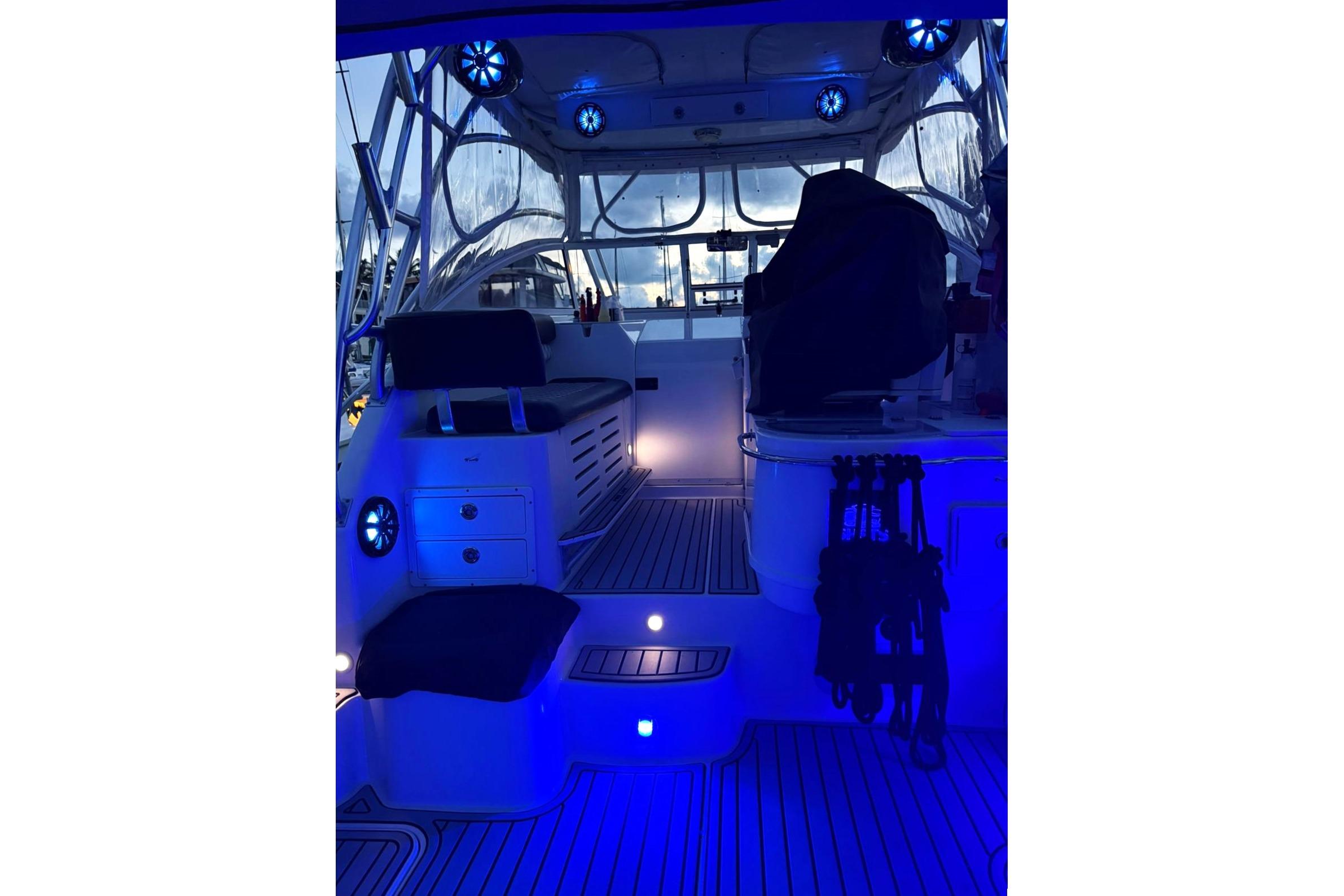 Interior of 2006 Pro-Line 32 Express boat with blue ambient lighting.