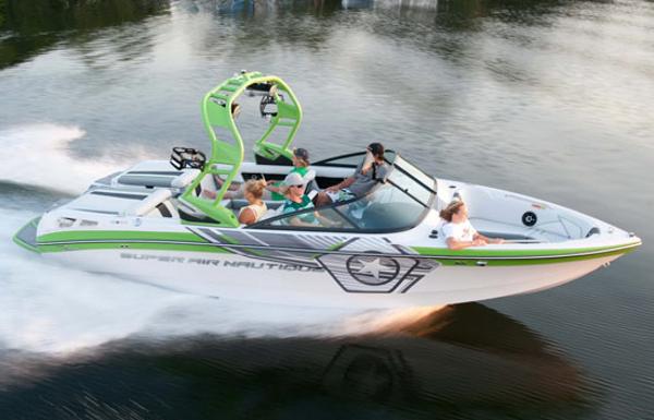 Manufacturer Provided Image: 2013 Nautique Super Air Nautique 230 speedboat cruising on a lake with passengers.