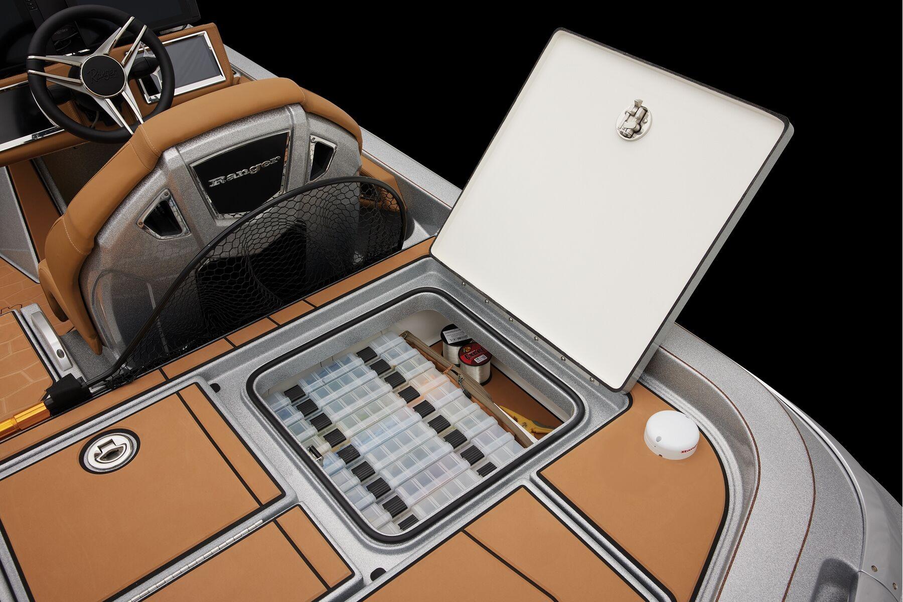 Manufacturer Provided Image: 2026 Ranger Z520R Ultra boat interior with open storage compartment and fishing gear.