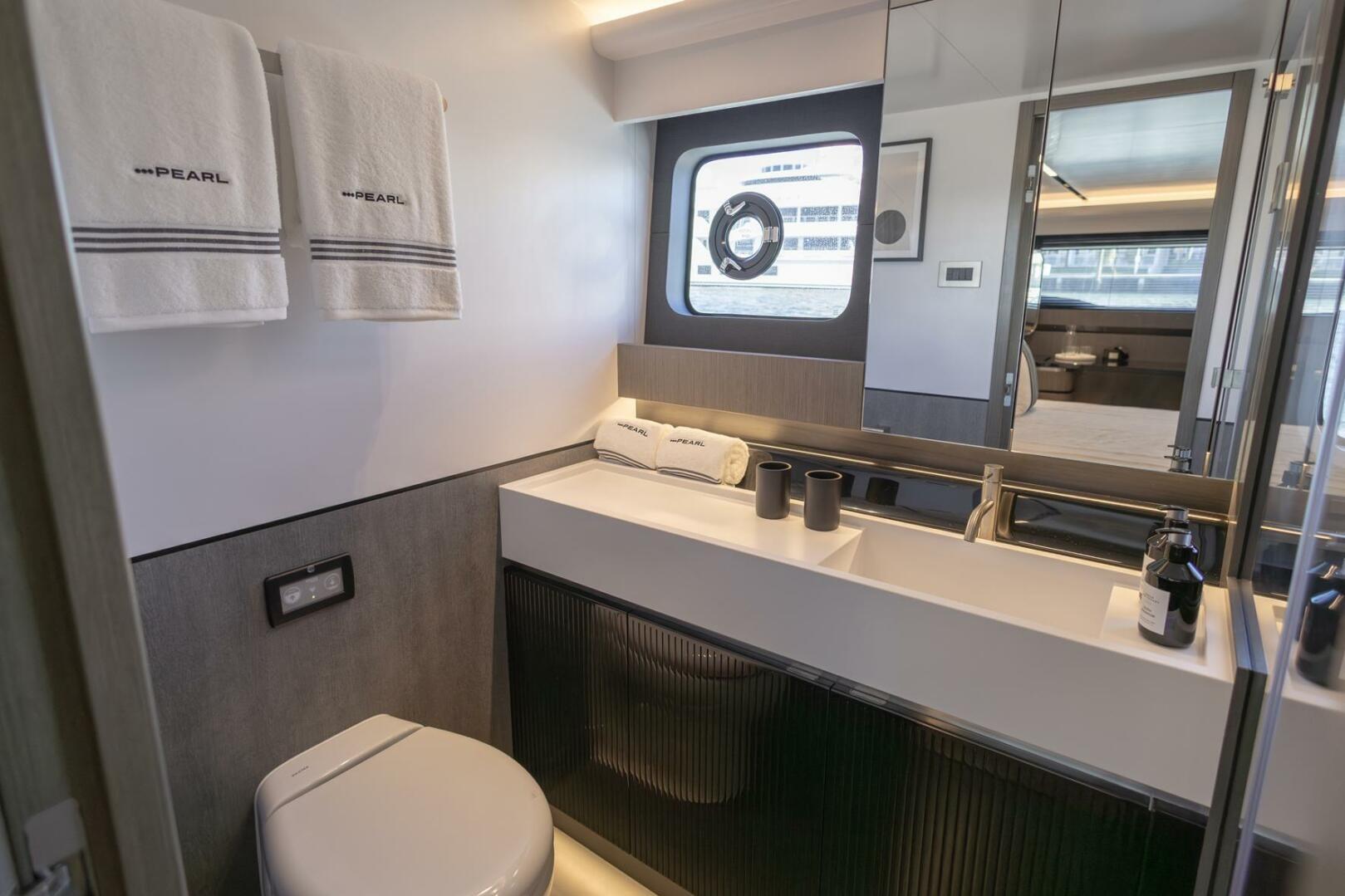 Luxurious bathroom in 2023 Pearl 72 yacht, featuring modern fixtures and elegant design.