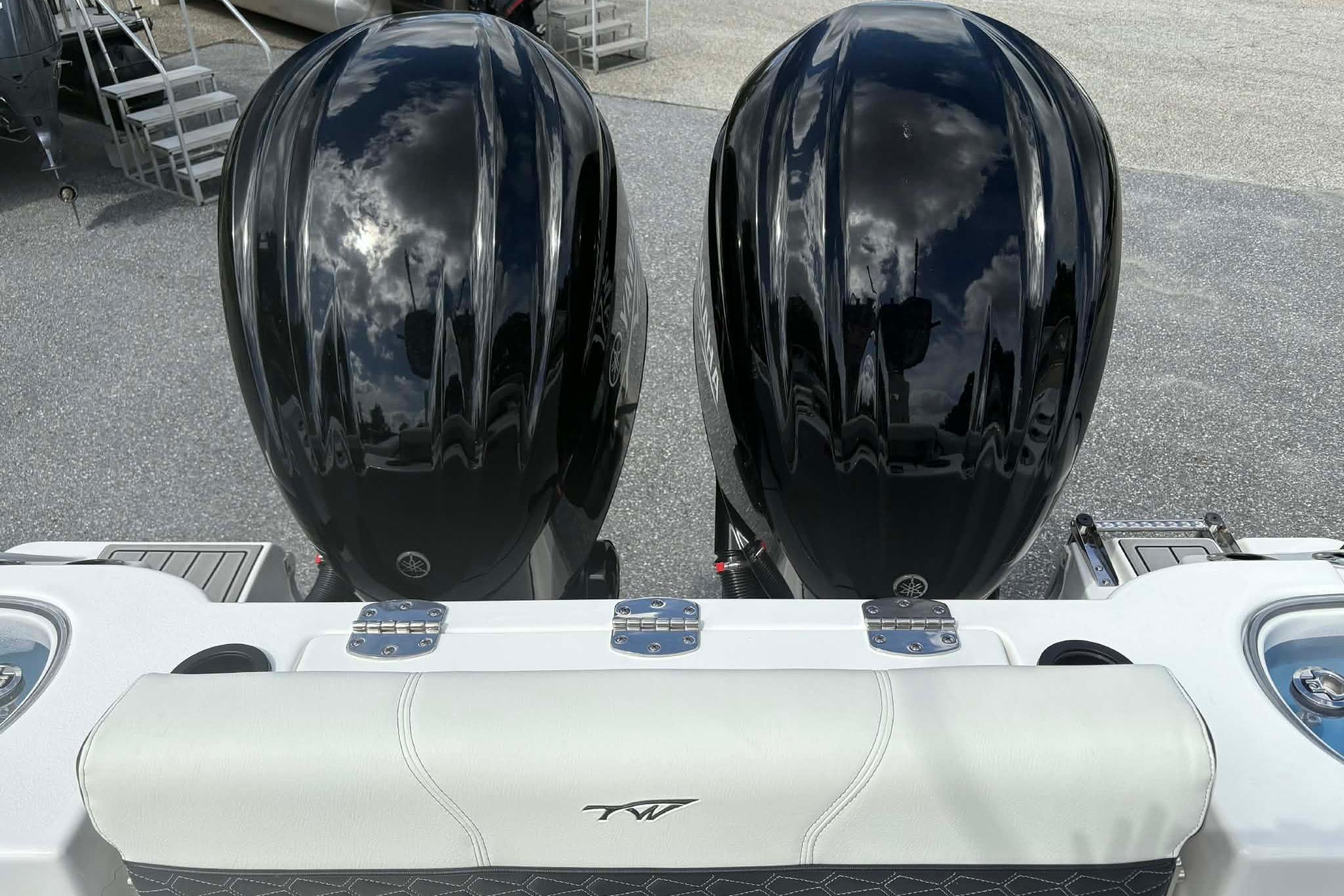 Twin black outboard motors on a 2026 Tidewater 282 CC Adventure boat.