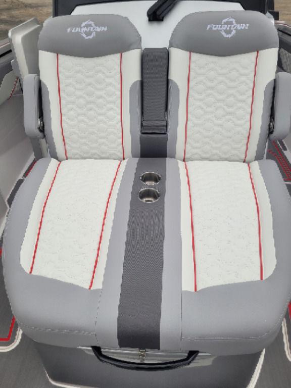2024 Fountain 38 SCX boat seats with gray, white, and red accents, featuring cup holders.