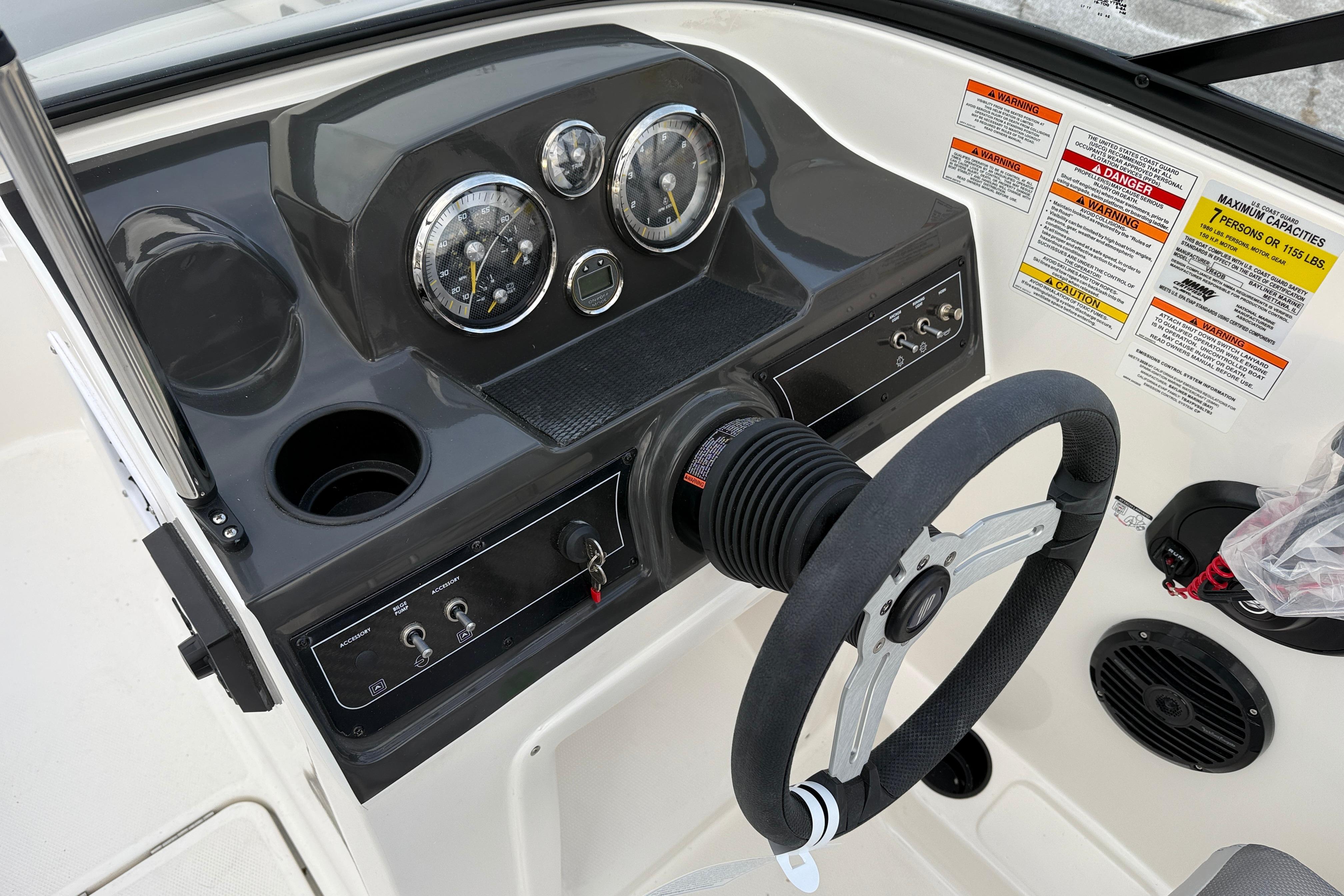 2026 Bayliner VR4 Bowrider OB dashboard with steering wheel and gauges.